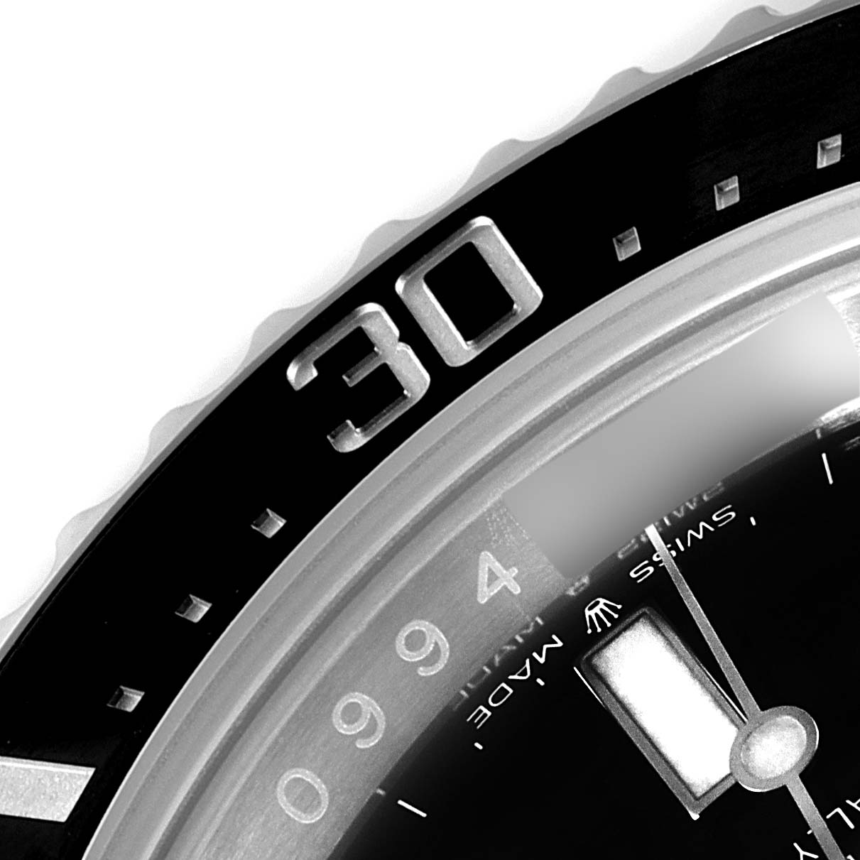 This close-up image shows the bezel and part of the dial of a Rolex Sea-Dweller 126600 Men
s Stainless Steel Black Dial 126600 Men
s Stainless Steel Black Dial watch, focusing on the 30-minute mark.