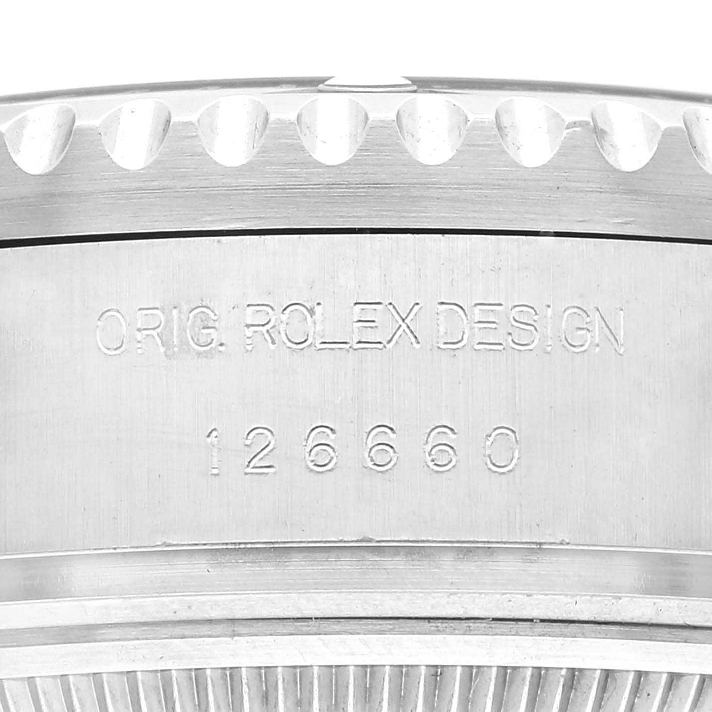 This image shows a close-up of the serial and design numbers on the case back of a Rolex Sea-Dweller 126660 Men
s Stainless Steel Black Dial 126660 Men
s Stainless Steel Black Dial watch.