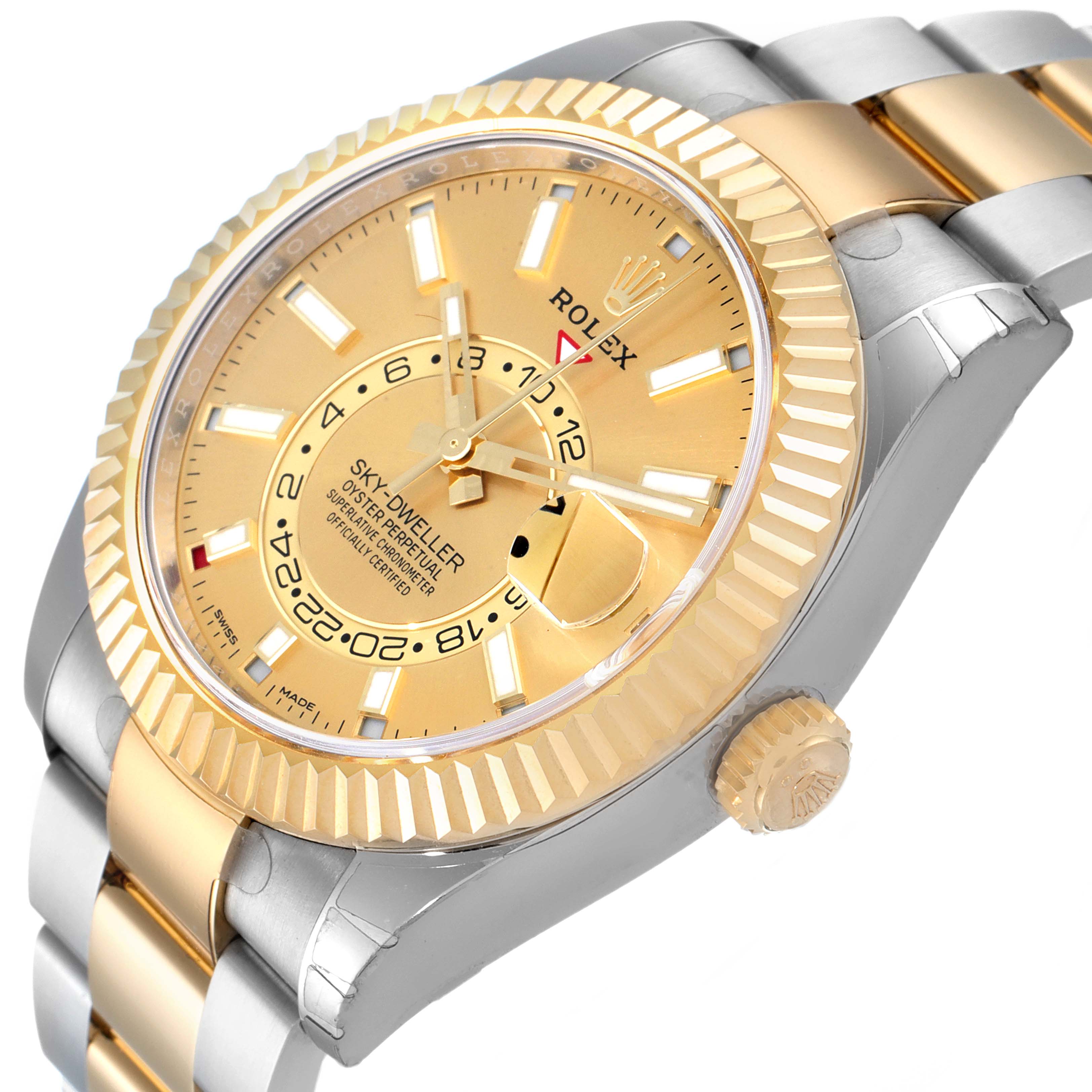 The image shows a Rolex Sky-Dweller 326933 Men's Yellow Gold Champagne Dial 326933 Men's Yellow Gold Champagne Dial watch from an angled side view, displaying the dial, fluted bezel, and part of the bracelet.