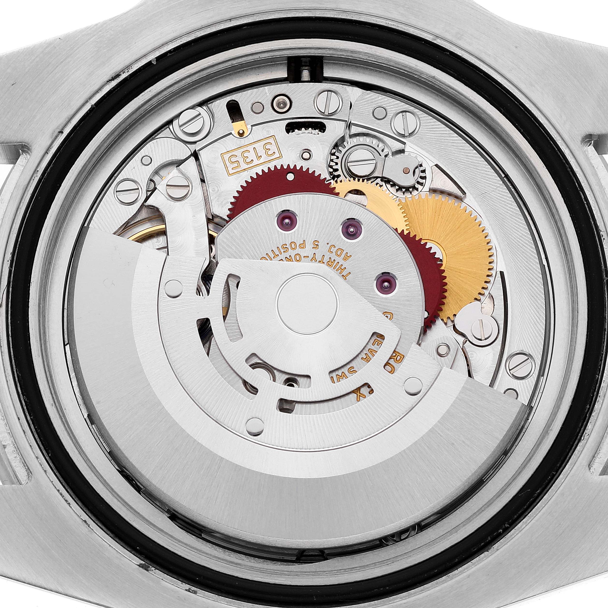 The image shows the back view of a Rolex Submariner 116610 Men's Stainless Steel Black Dial 116610 Men's Stainless Steel Black Dial watch's internal mechanism, including various gears and components.