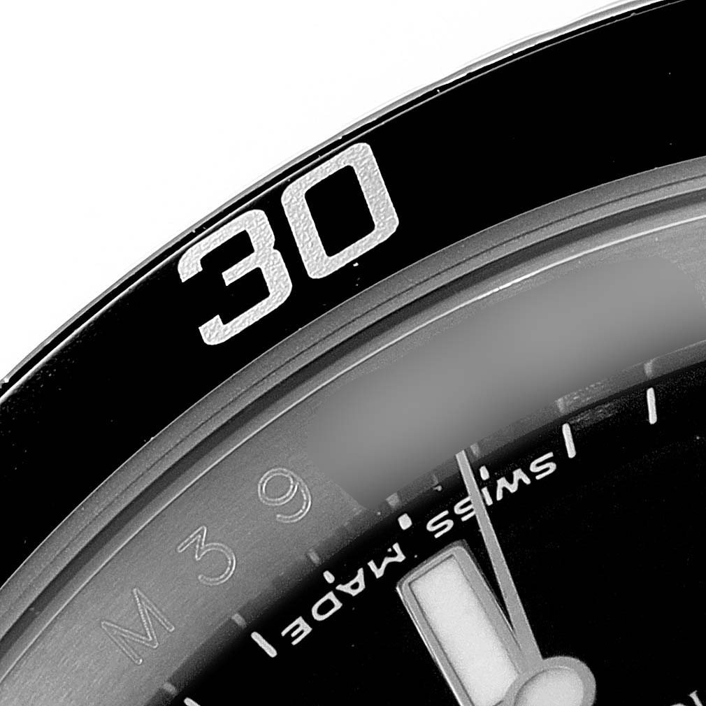 The image shows a close-up of the bezel and part of the dial on a Rolex Submariner 16610 Men
s Stainless Steel Black Dial 16610 Men
s Stainless Steel Black Dial watch, highlighting the "30" minute mark.