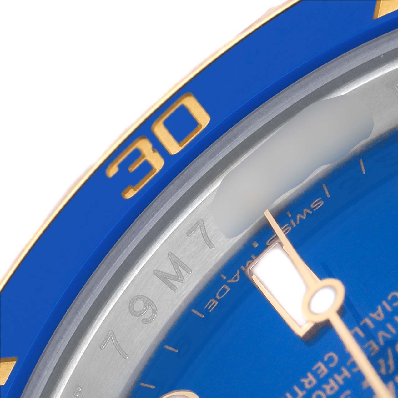The image shows a close-up of the Rolex Submariner 116613 Men's Steel and Gold (two tone) Blue Dial's blue bezel and part of the dial, with gold accents and a "30" marking.