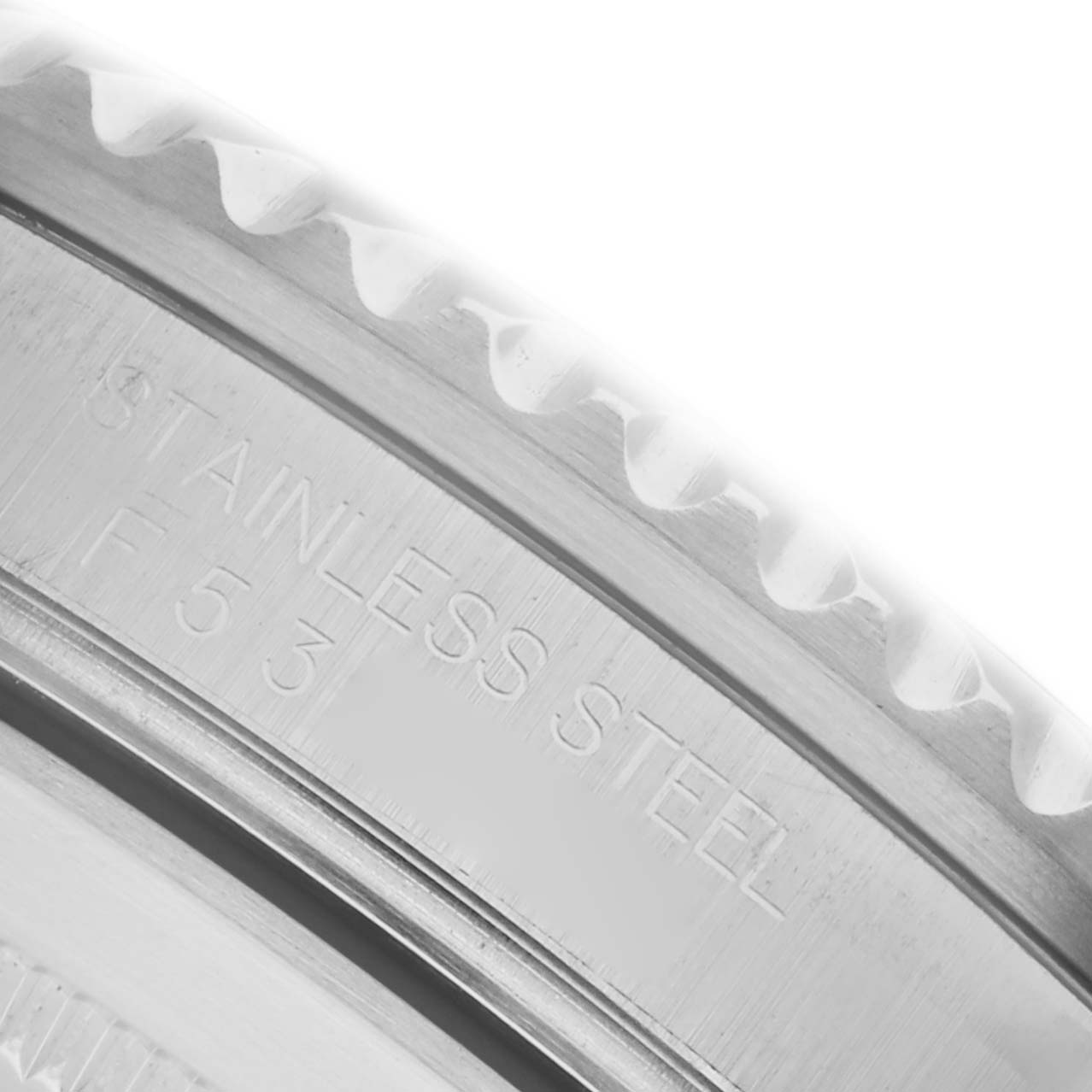 The image shows a close-up of the stainless steel bezel edge of a Rolex Submariner 16610LV Men's Stainless Steel Black Dial 16610LV Men's Stainless Steel Black Dial watch.