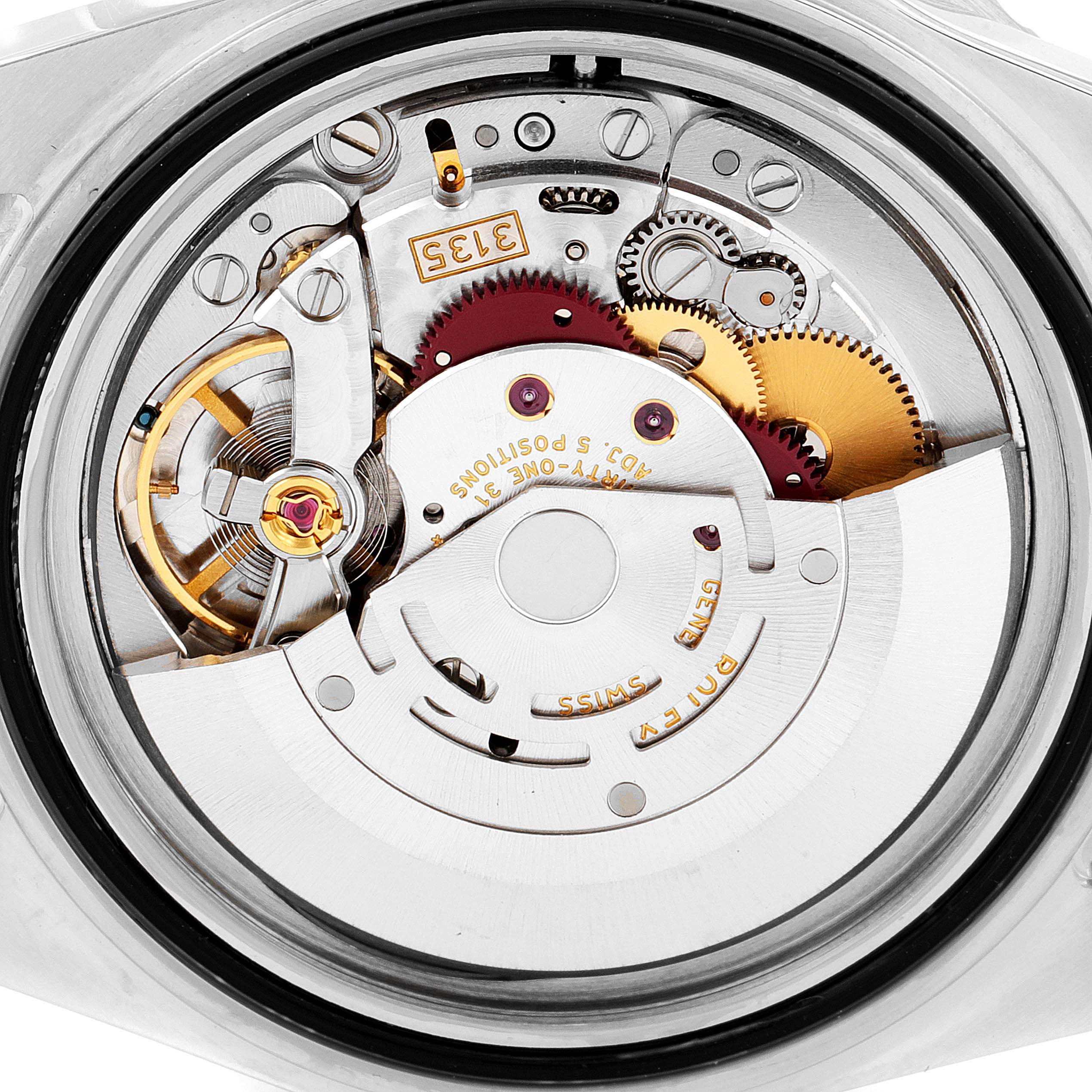 This image shows the intricate mechanical movement of a Rolex Submariner 16613 Men's Steel and Gold (two tone) Champagne Dial 16613 Men's Steel and Gold (two tone) Champagne Dial watch from an open-back view.