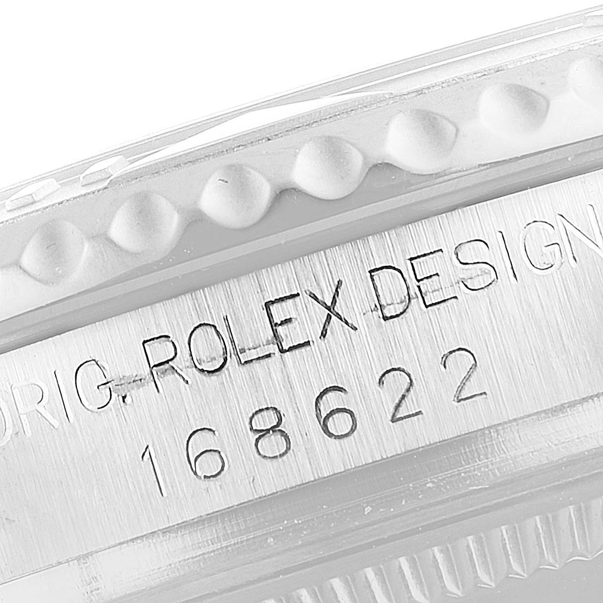 This close-up image displays the engraved model number and "ROLEX DESIGN" text on the side of a Rolex Yacht-Master 168622 Men
s Stainless Steel Silver Dial 168622 Men
s Stainless Steel Silver Dial watch case.
