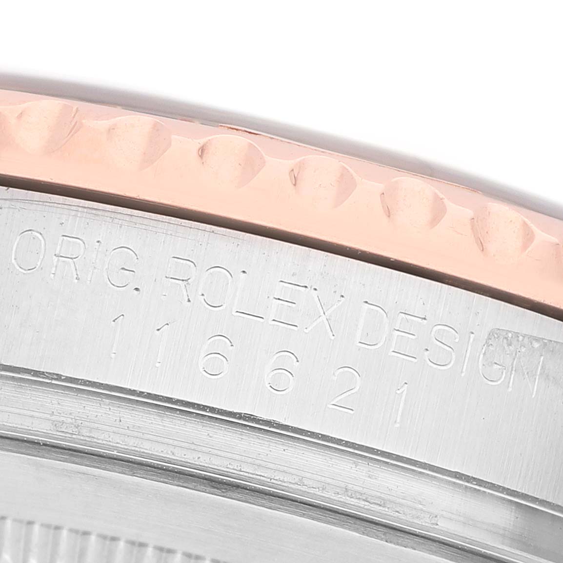 The image shows a close-up of the side of the Rolex Yacht-Master 116621 Men's Steel and Gold (two tone) Brown Dial case, highlighting the bezel and engraved model number.