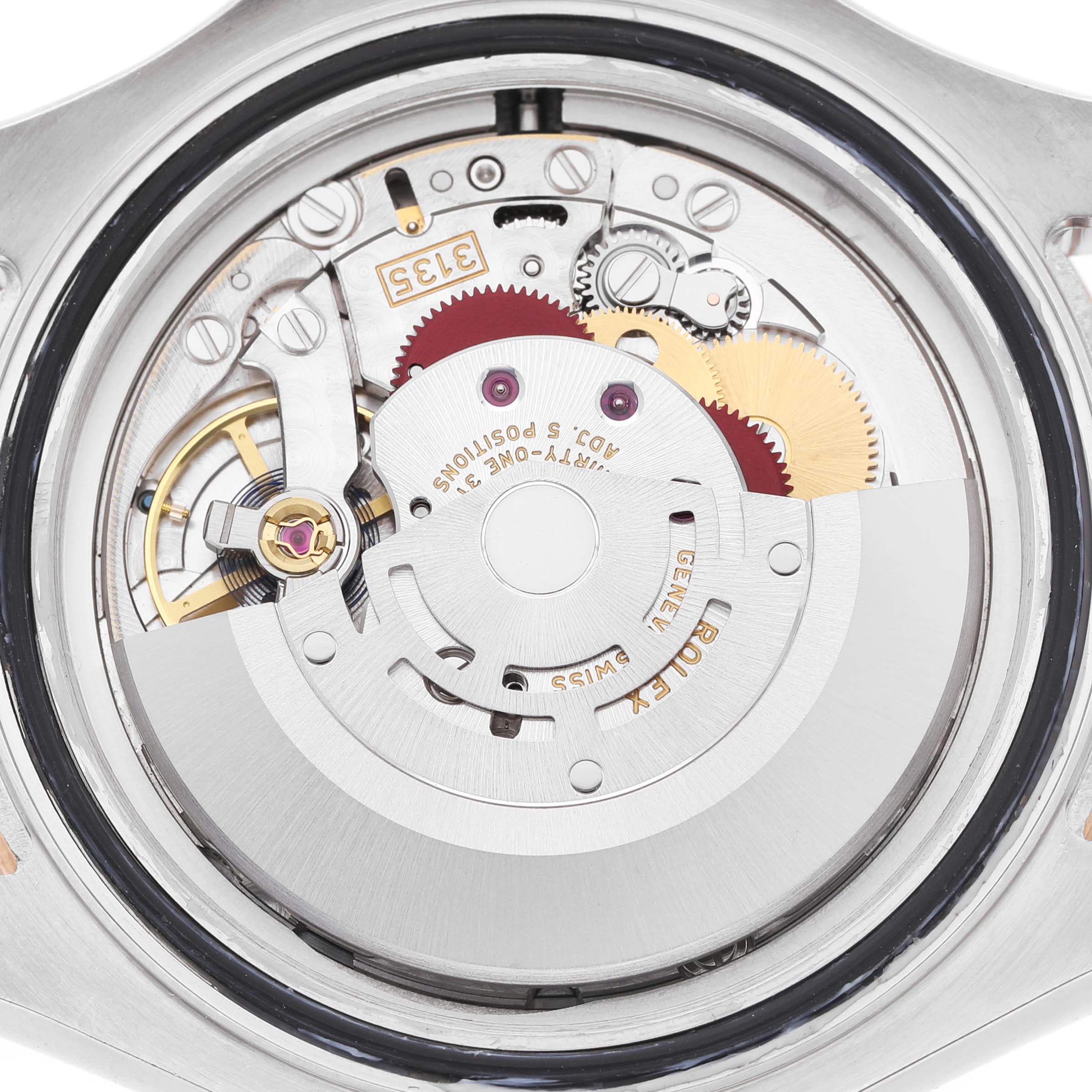 The image shows the intricate movement mechanism of a Rolex Yacht-Master 116621 Men's Steel and Gold (two tone) Brown Dial watch from a back or underside angle.