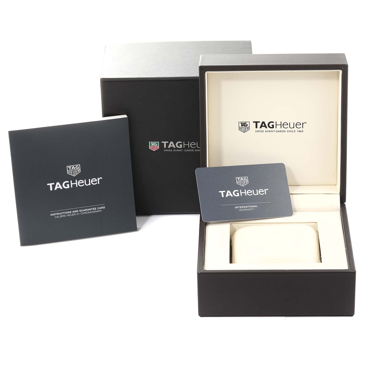 The image shows the packaging, instructions, and warranty card for a Tag Heuer Carrera CAR2A1Z.FT6044 Men
s Stainless Steel Black Dial CAR2A1Z.FT6044 Men
s Stainless Steel Black Dial watch.