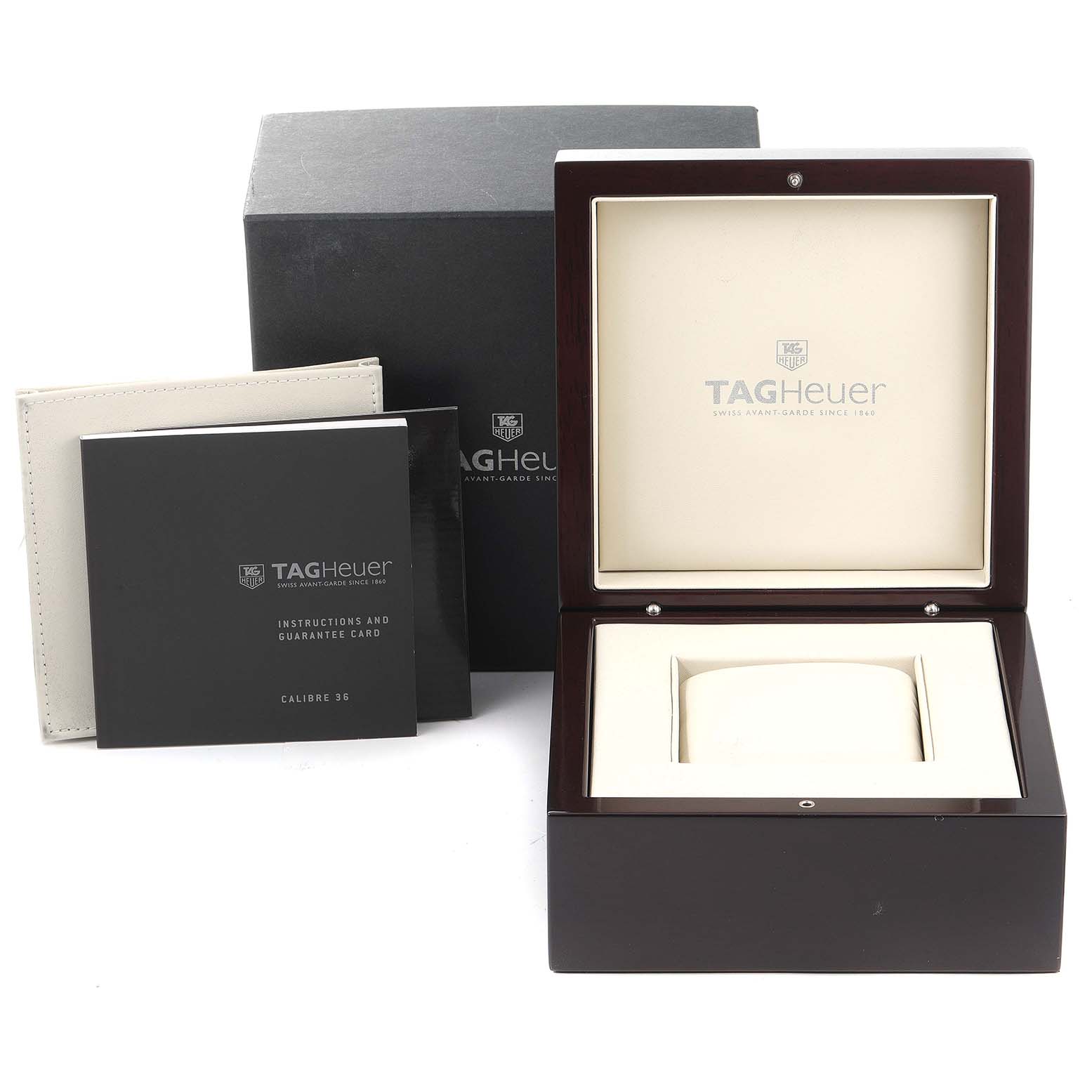 This image shows the packaging and accessories for a Tag Heuer Carrera CAV5115.BA0902 Men's Stainless Steel Black Dial CAV5115.BA0902 Men's Stainless Steel Black Dial model, including the box, instruction manuals, and warranty card.