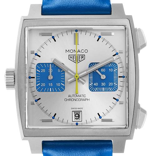 The Tag Heuer Monaco watch is shown from a front angle, displaying the dial, subdials, hands, and crown.