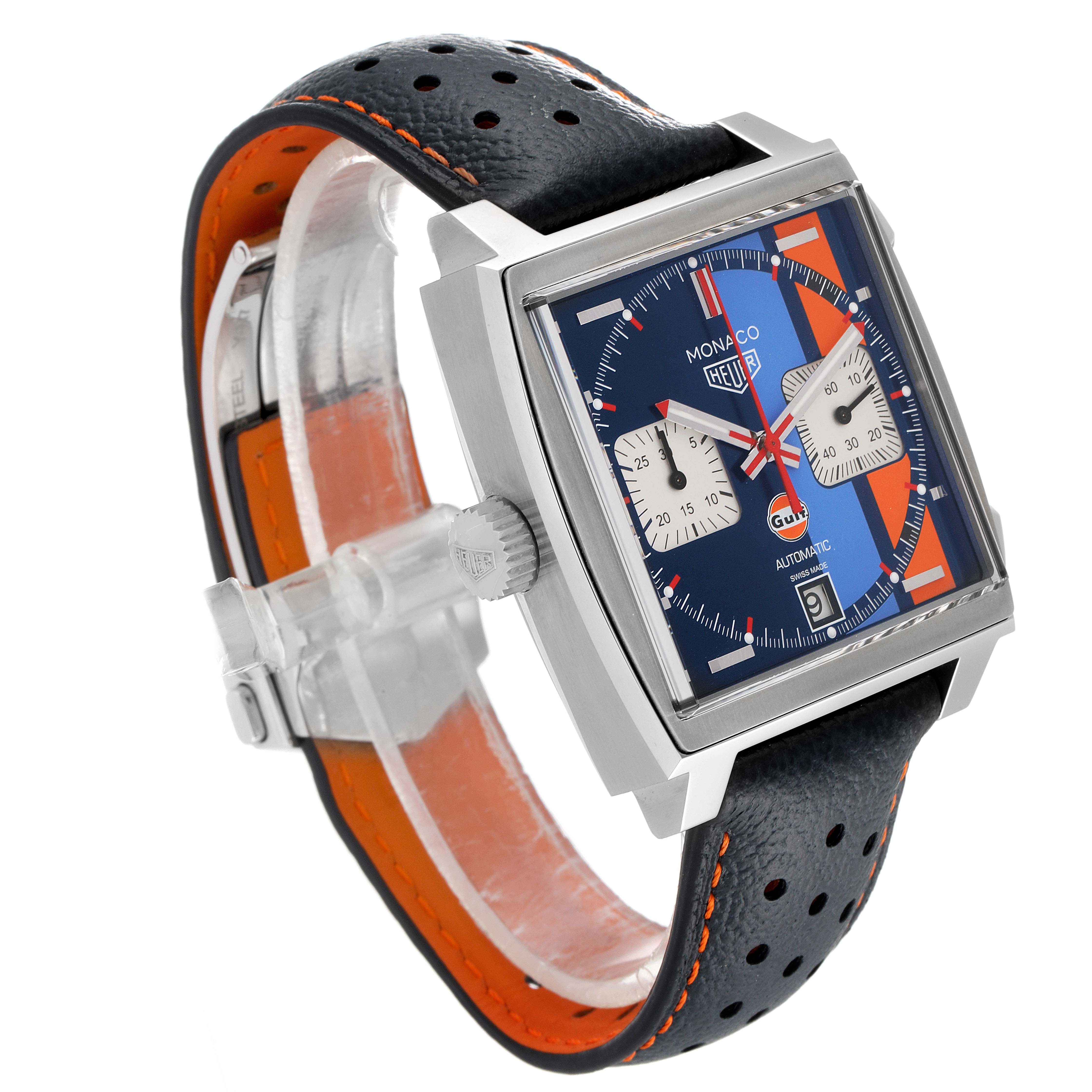 This image shows a side angle of a Tag Heuer Monaco CAW211R.FC6401 Men's Stainless Steel Blue Dial CAW211R.FC6401 Men's Stainless Steel Blue Dial watch, showcasing its square case, crown, perforated leather strap, and dial.