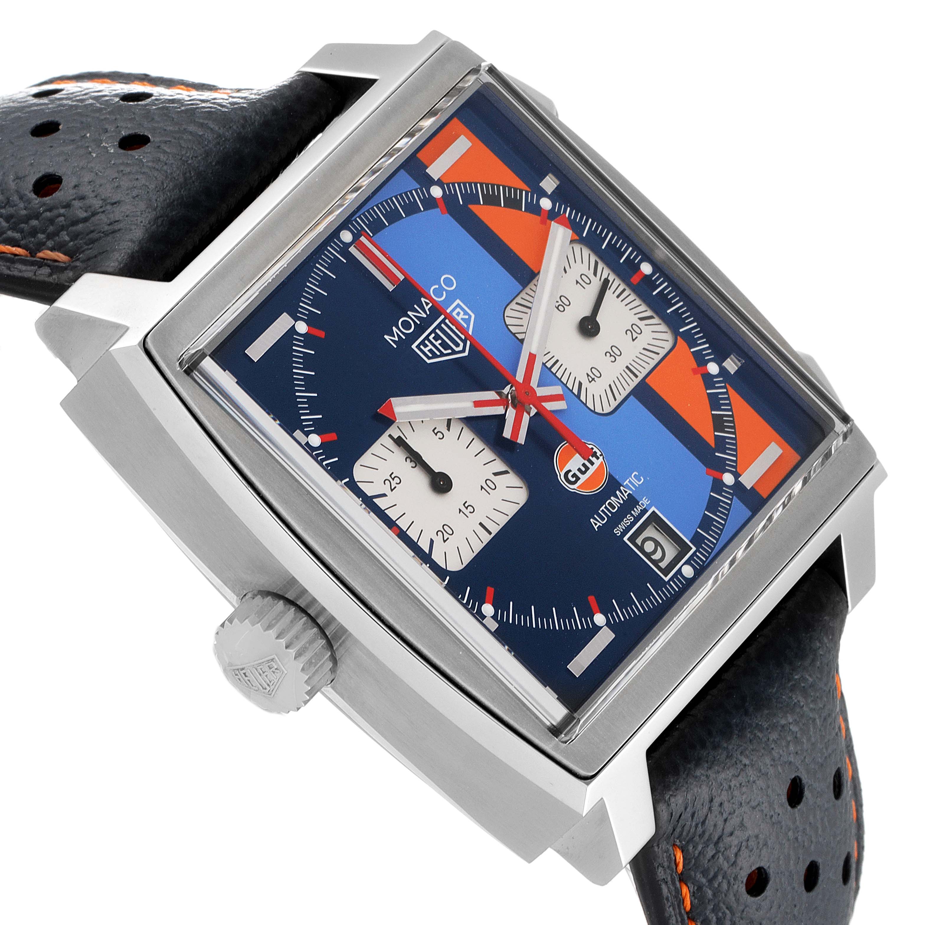 The image shows a side angle of the Tag Heuer Monaco CAW211R.FC6401 Men's Stainless Steel Blue Dial CAW211R.FC6401 Men's Stainless Steel Blue Dial watch, highlighting its square face, chronograph subdials, and perforated strap.