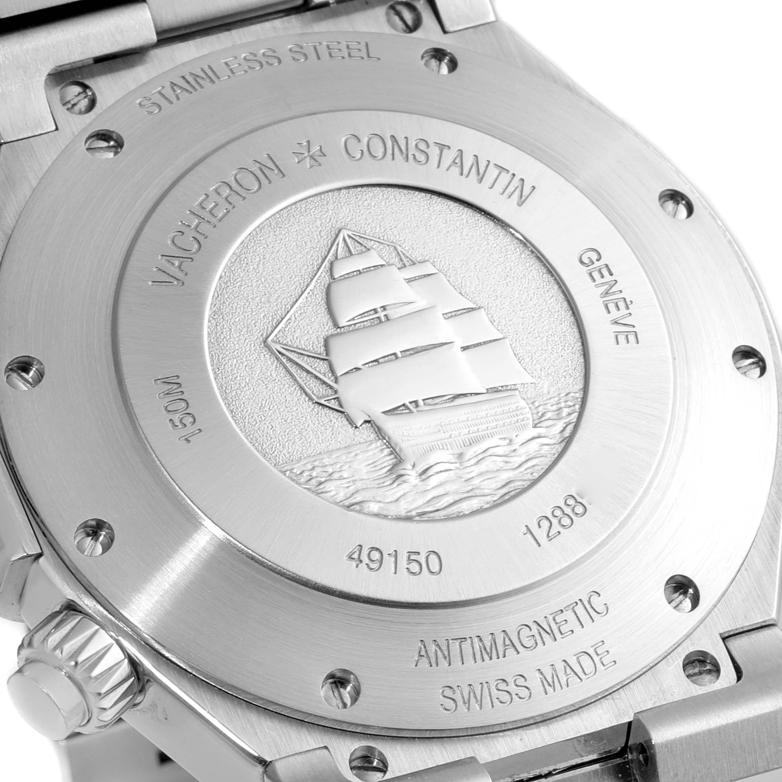 This image shows the case back of a Vacheron Constantin Overseas 49150/000A-9745 Men's Stainless Steel Blue Dial 49150/000A-9745 Men's Stainless Steel Blue Dial model watch, highlighting its engraved ship design and inscriptions.
