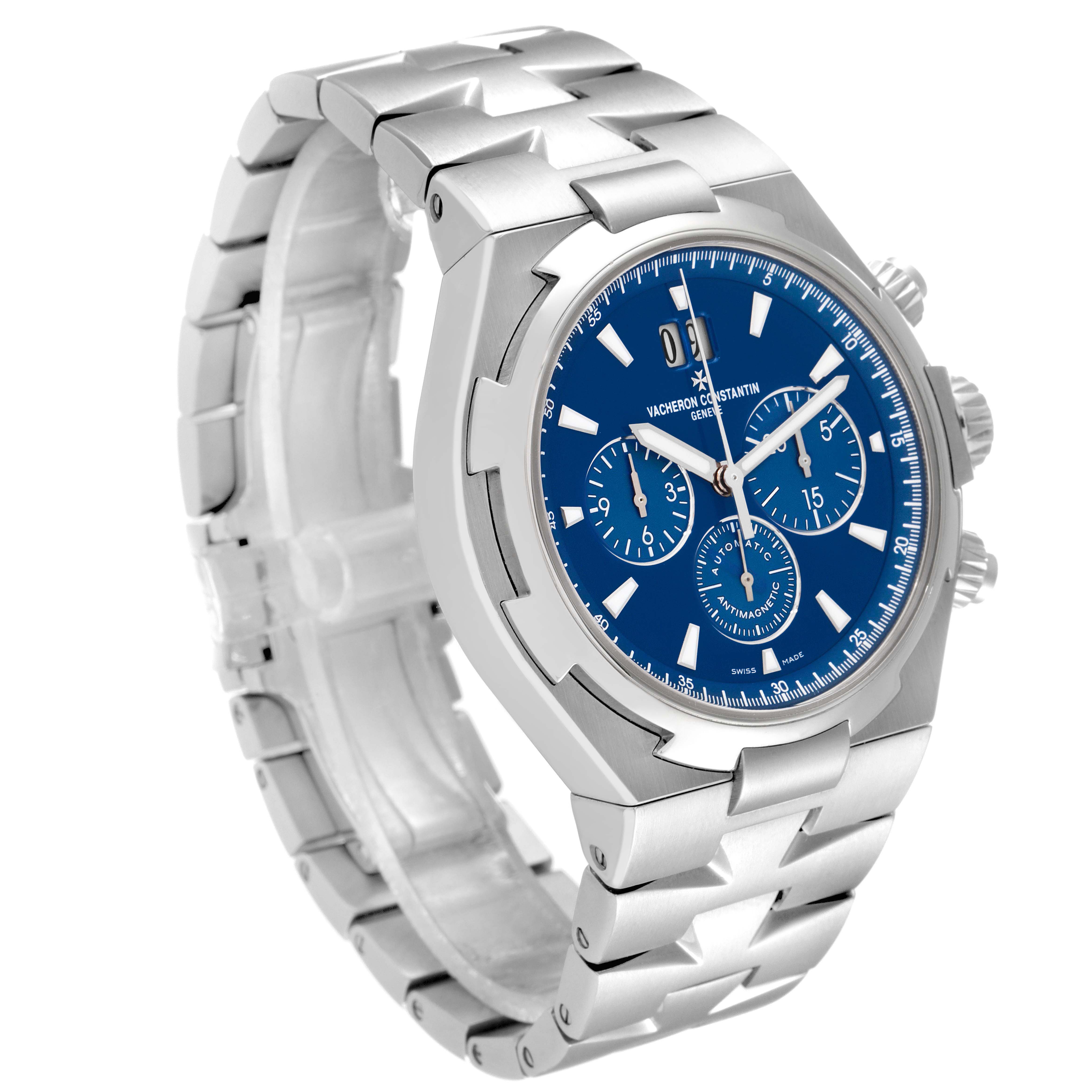 The Vacheron Constantin Overseas 49150/000A-9745 Men's Stainless Steel Blue Dial watch is shown at an angled view, highlighting its blue dial, bracelet, and chronograph sub-dials.