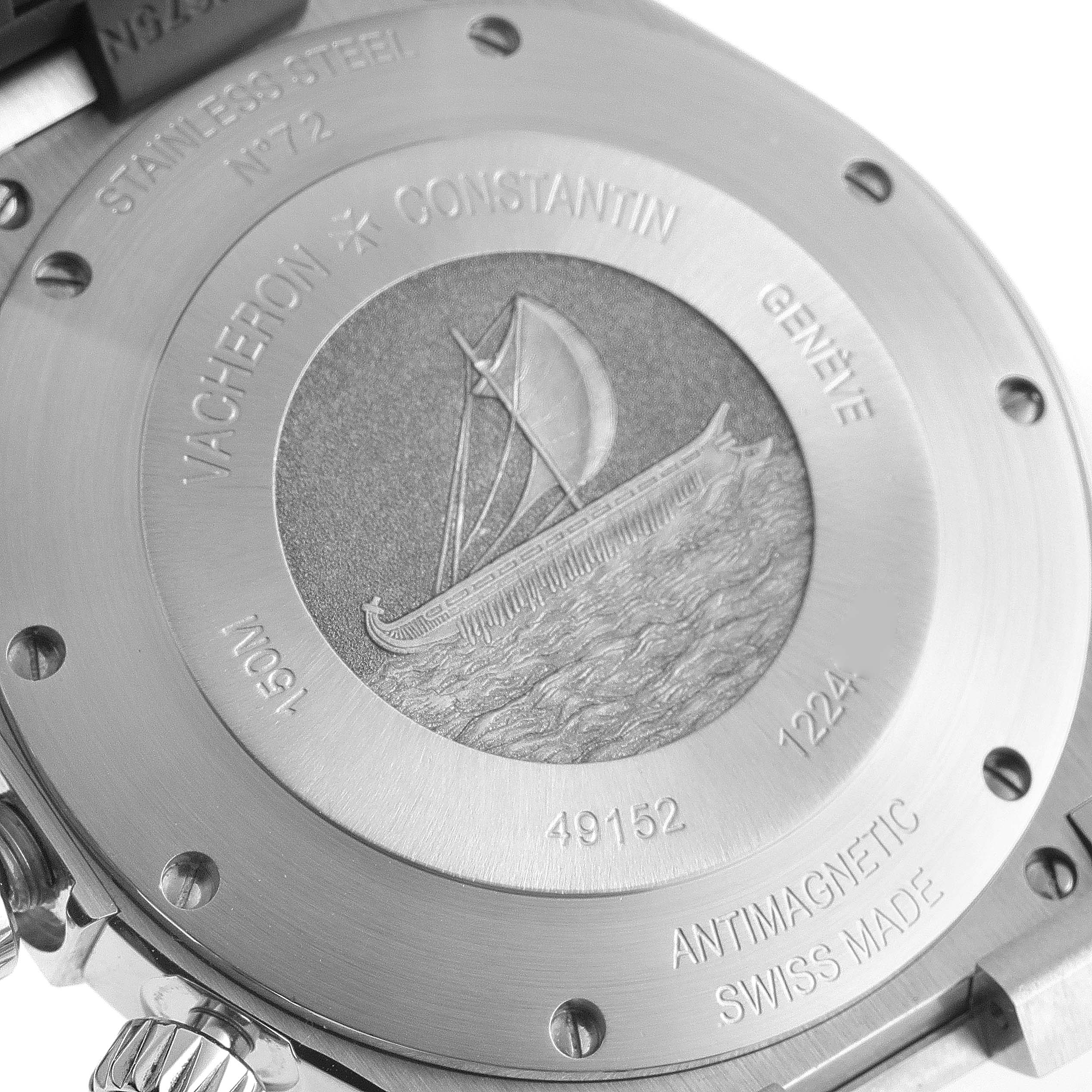 The image shows the case back of a Vacheron Constantin Overseas 49152/000A-9540 Men's Stainless Steel Blue Dial 49152/000A-9540 Men's Stainless Steel Blue Dial watch, highlighting engravings and the brand's logo.