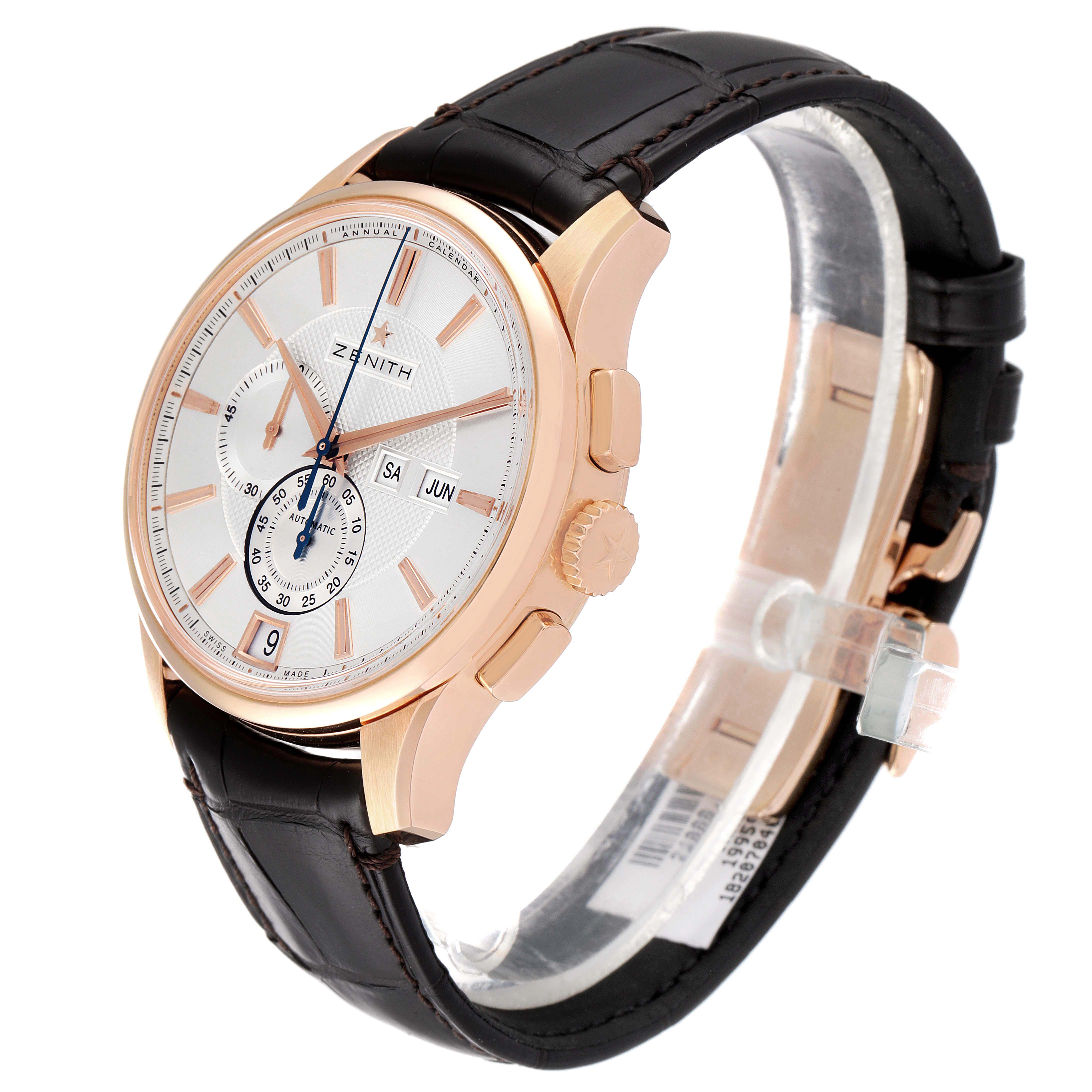 The Zenith El Primero 18.2070.4054/02.C711 Men's Rose Gold Silver Dial 18.2070.4054/02.C711 Men's Rose Gold Silver Dial watch is shown at an angle, highlighting its gold case, leather strap, crown, and pushers.