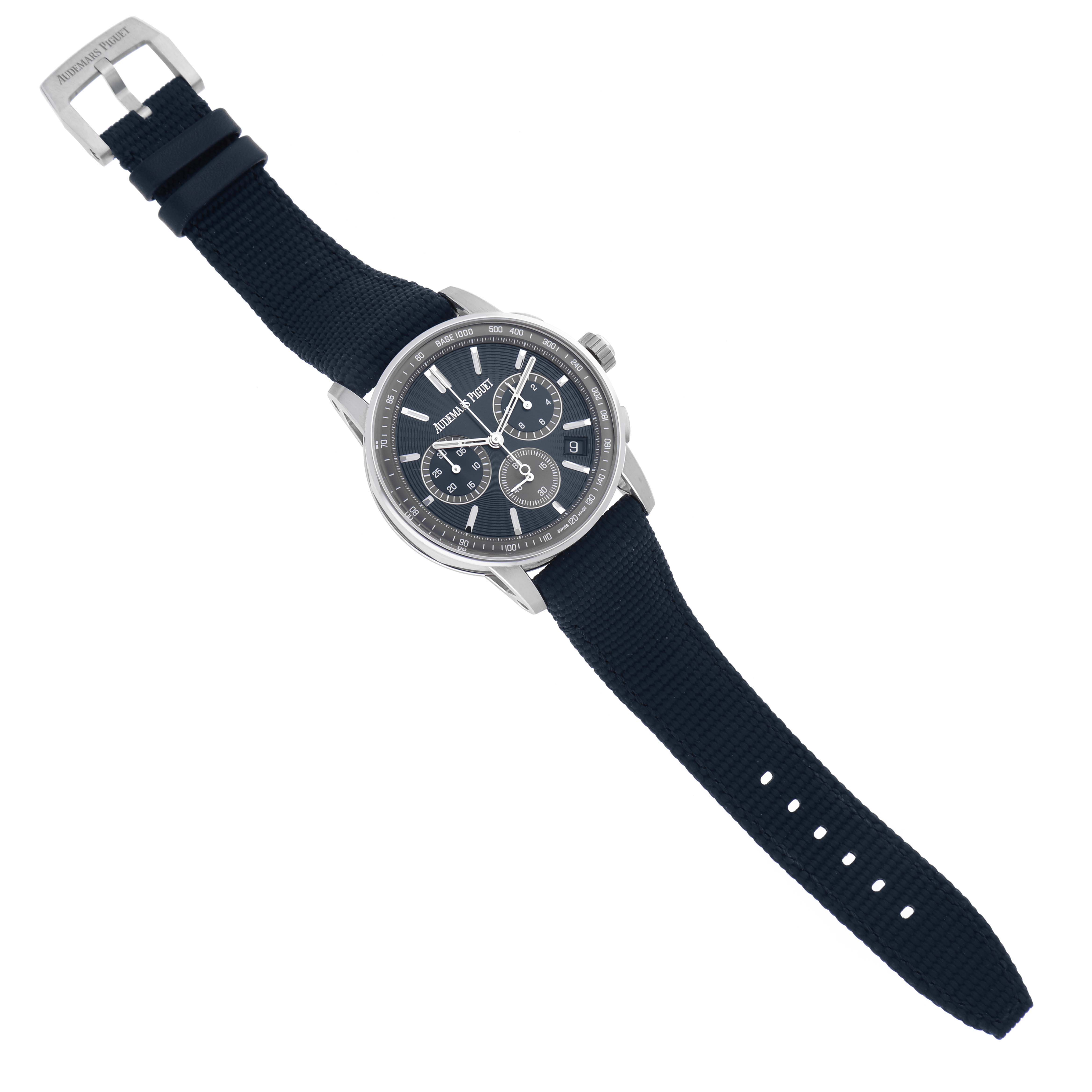 The Audemars Piguet Jules 26393ST.OO.A348KB.01 Men's Stainless Steel Blue Dial 26393ST.OO.A348KB.01 Men's Stainless Steel Blue Dial watch is angled diagonally, showing the face, crown, and black strap with buckle.