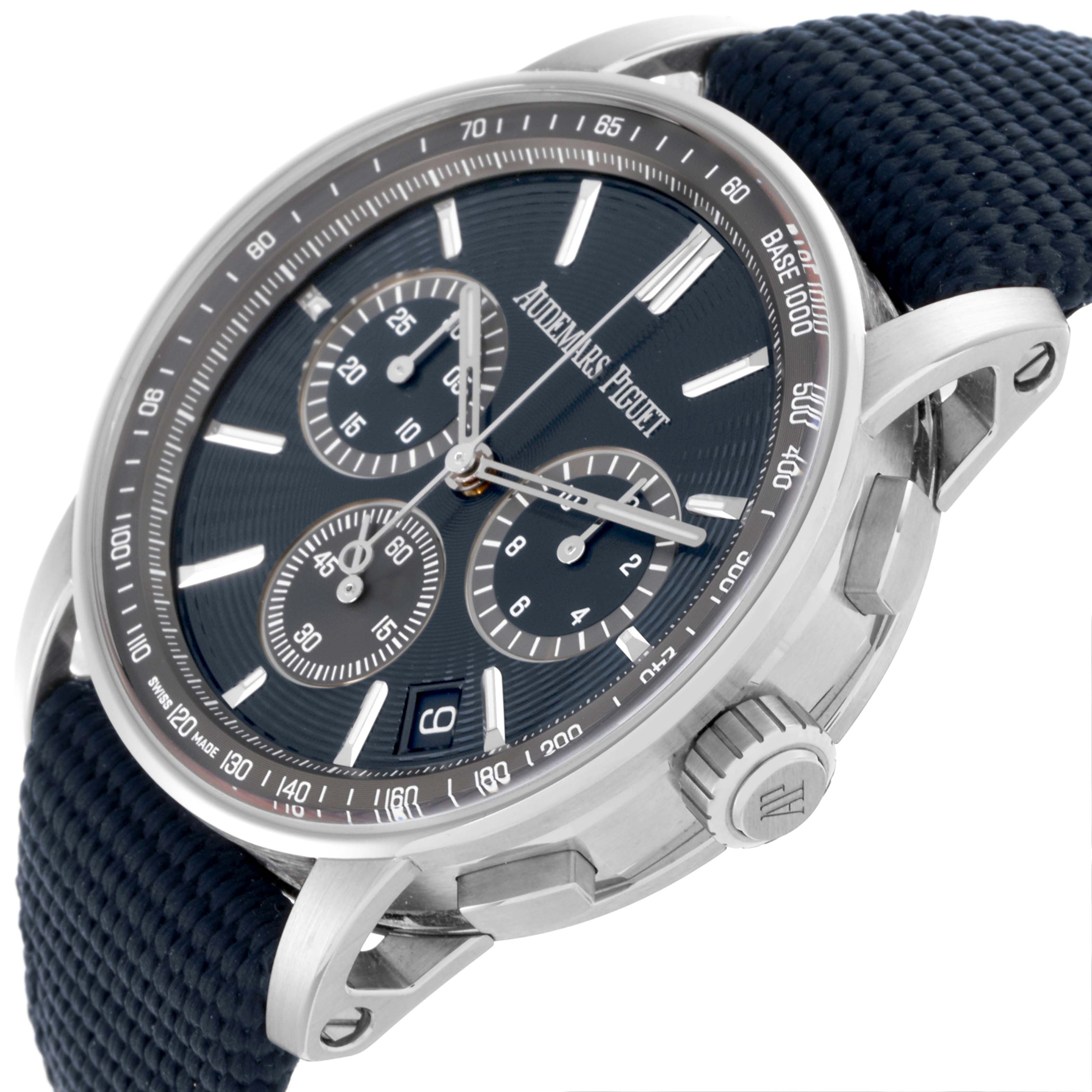 The Jules model by Audemars Piguet is shown at a tilted angle, highlighting the face, subdials, and crown, with a strap detail.