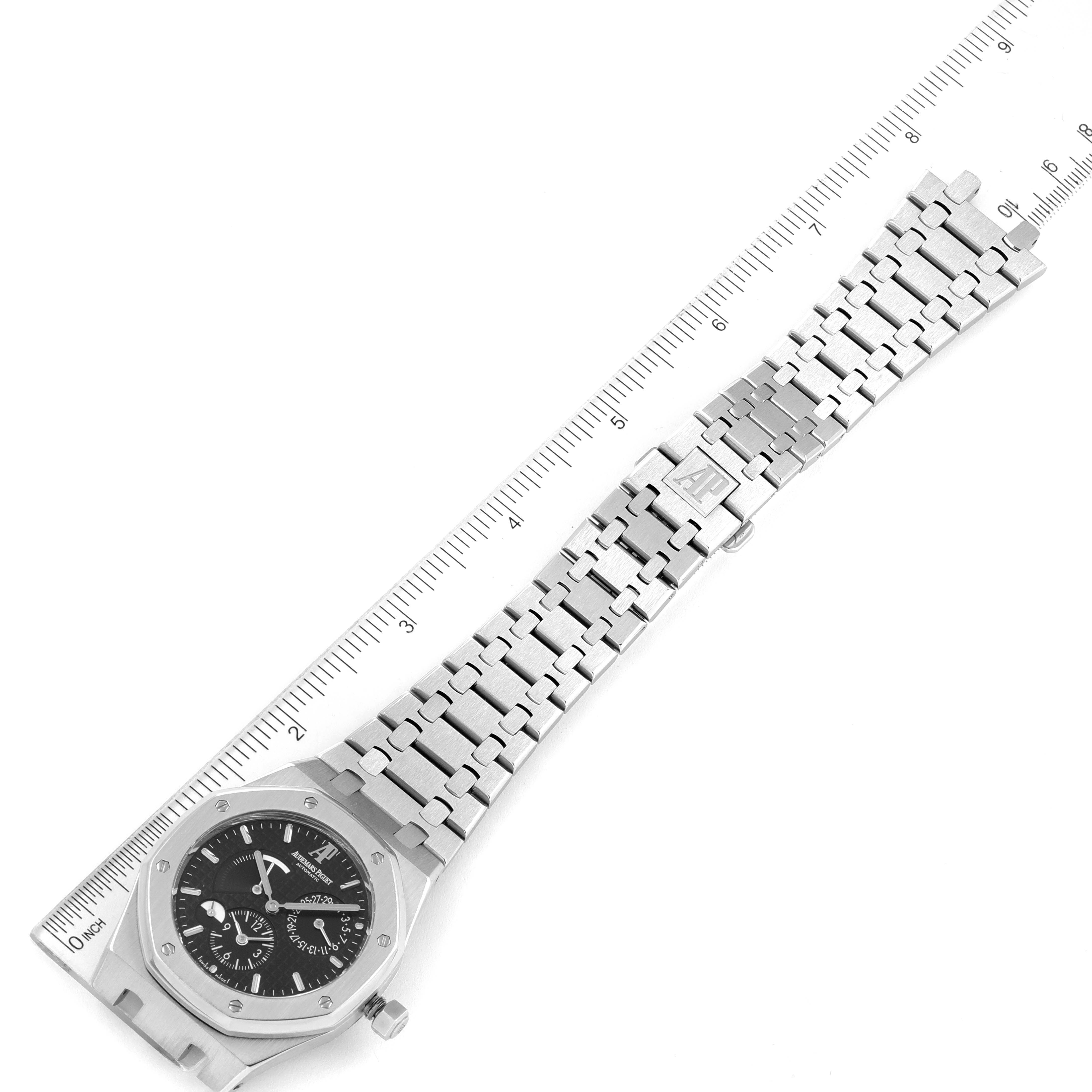 The image shows a top view of an Audemars Piguet Royal Oak 26120ST.00.1220ST.03 Men's Stainless Steel Black Dial 26120ST.00.1220ST.03 Men's Stainless Steel Black Dial watch, displaying the watch face, bracelet, and a ruler for size reference.