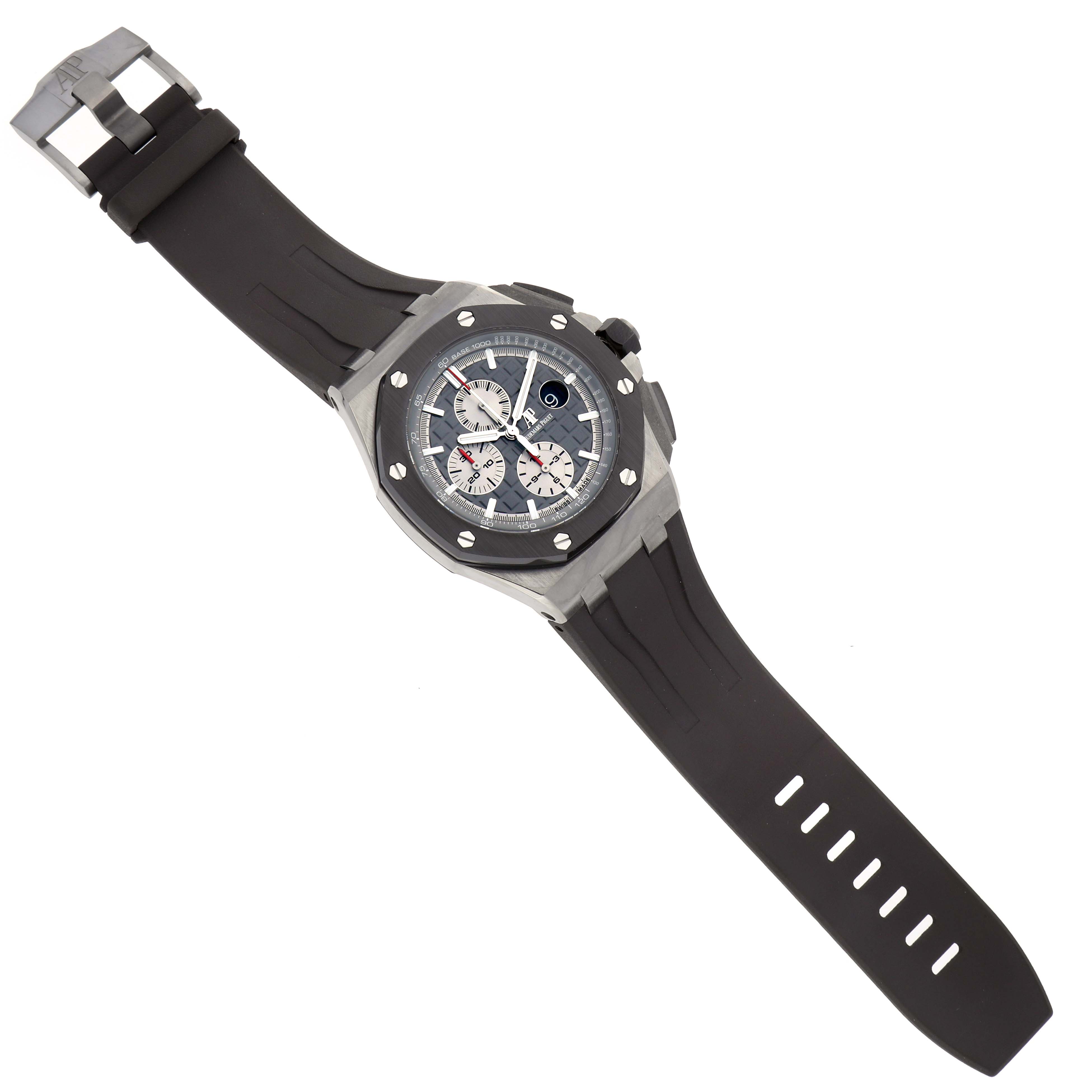 The Audemars Piguet Royal Oak Offshore 26400IO.OO.A004CA.01 Men's Titanium Grey Dial watch is shown at an angled overhead view, displaying its face, bezel, and rubber strap.