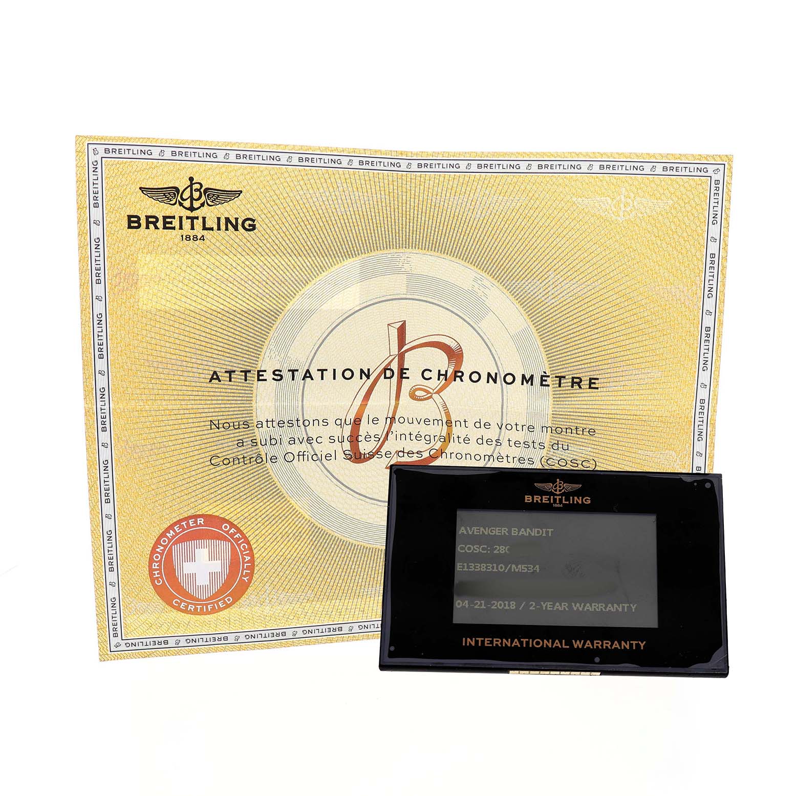 The image shows the Breitling Avenger E13383 Men's Titanium Grey Dial model's certification and warranty card from a top-front angle.