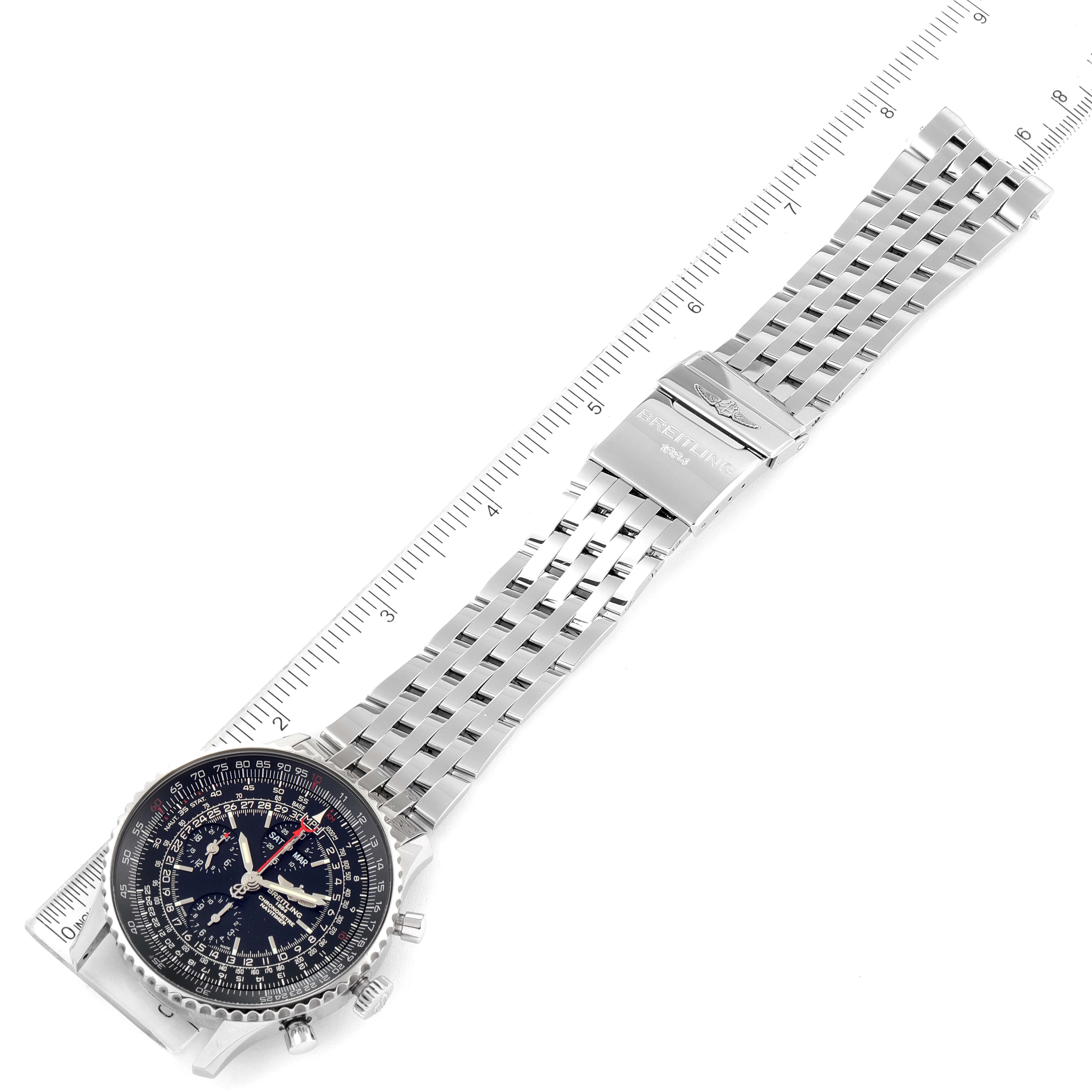 The image shows a Breitling Navitimer A2135024/BE62-453A Men's Stainless Steel Black Dial A2135024/BE62-453A Men's Stainless Steel Black Dial watch laid flat, displaying the face, bezel, crown, pushers, and metal bracelet against a ruler.
