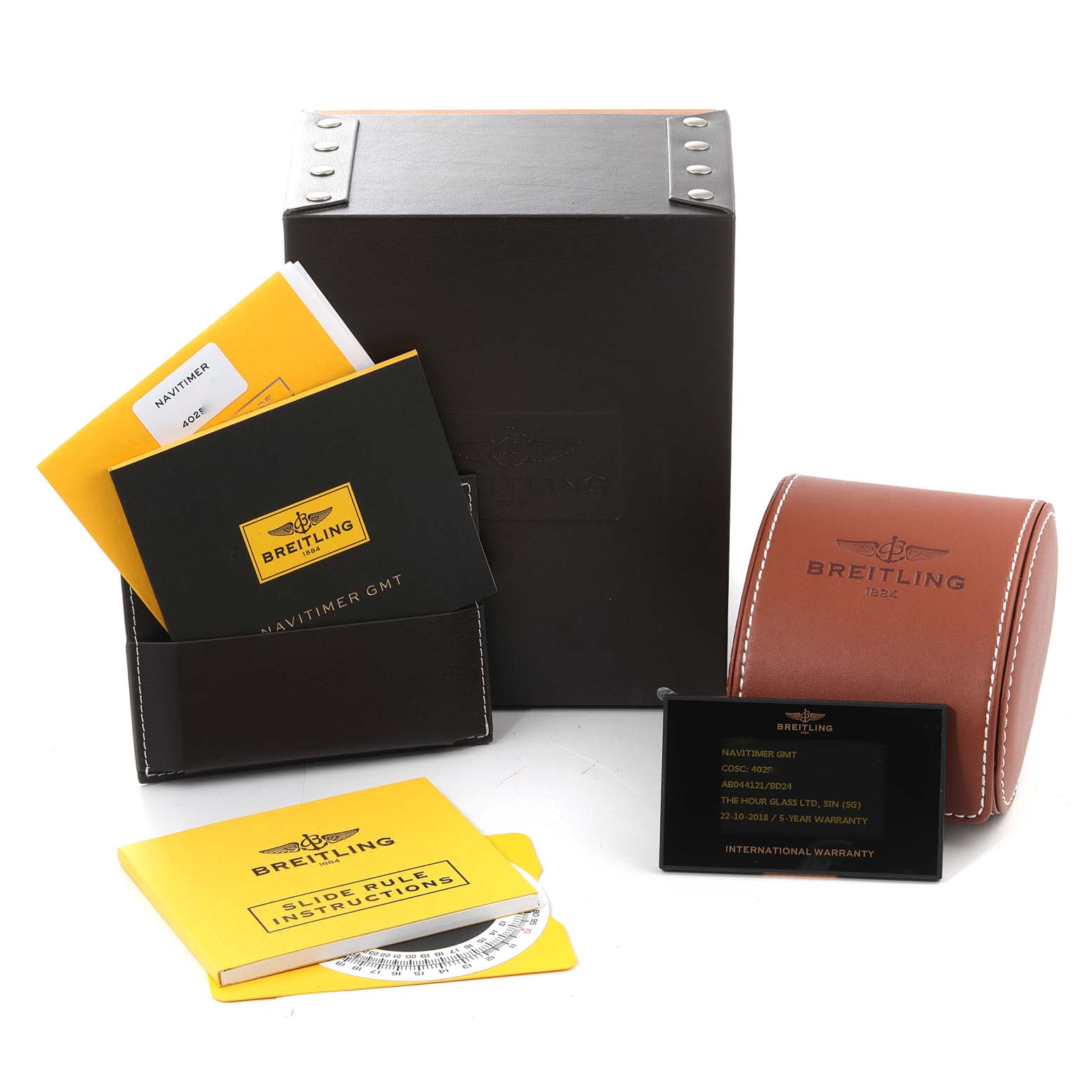 The image shows Breitling Navitimer AB044121/BD24/443A Men's Stainless Steel Black Dial AB044121/BD24/443A Men's Stainless Steel Black Dial watch accessories including a box, manuals, warranty card, and a leather travel case.