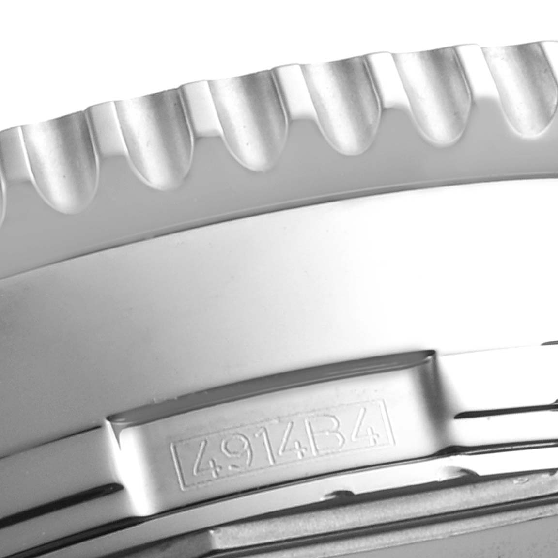 The image shows a close-up of the textured stainless steel bezel edge and an engraved number on the Breitling Navitimer A24322 Men's Stainless Steel Silver Dial A24322 Men's Stainless Steel Silver Dial watch.