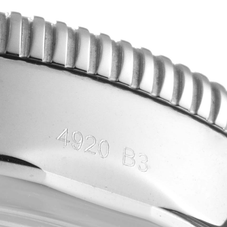 The image shows a close-up of the stainless steel bezel and engraved number of a Breitling Superocean AB0162 Men's Stainless Steel Silver Dial AB0162 Men's Stainless Steel Silver Dial watch.