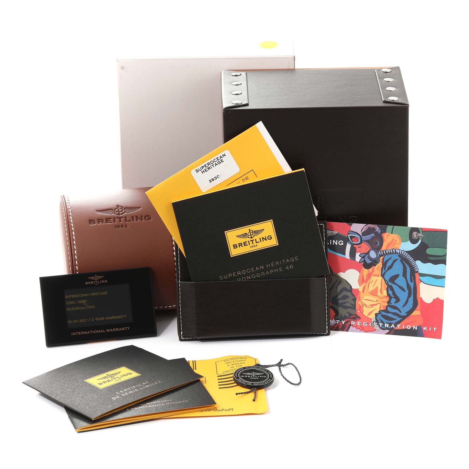 This image shows the packaging, manuals, and warranty cards for a Breitling Superocean M133201A/C943 Men's Stainless Steel Blue Dial M133201A/C943 Men's Stainless Steel Blue Dial Heritage Limited Series model.