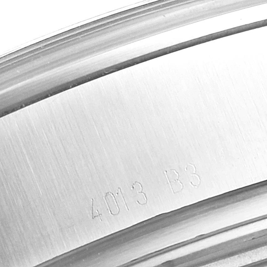 The image shows a close-up of the case back of a Breitling Transocean AB0510  Men's Stainless Steel Blue Dial AB0510  Men's Stainless Steel Blue Dial watch, showcasing the engraved serial number.