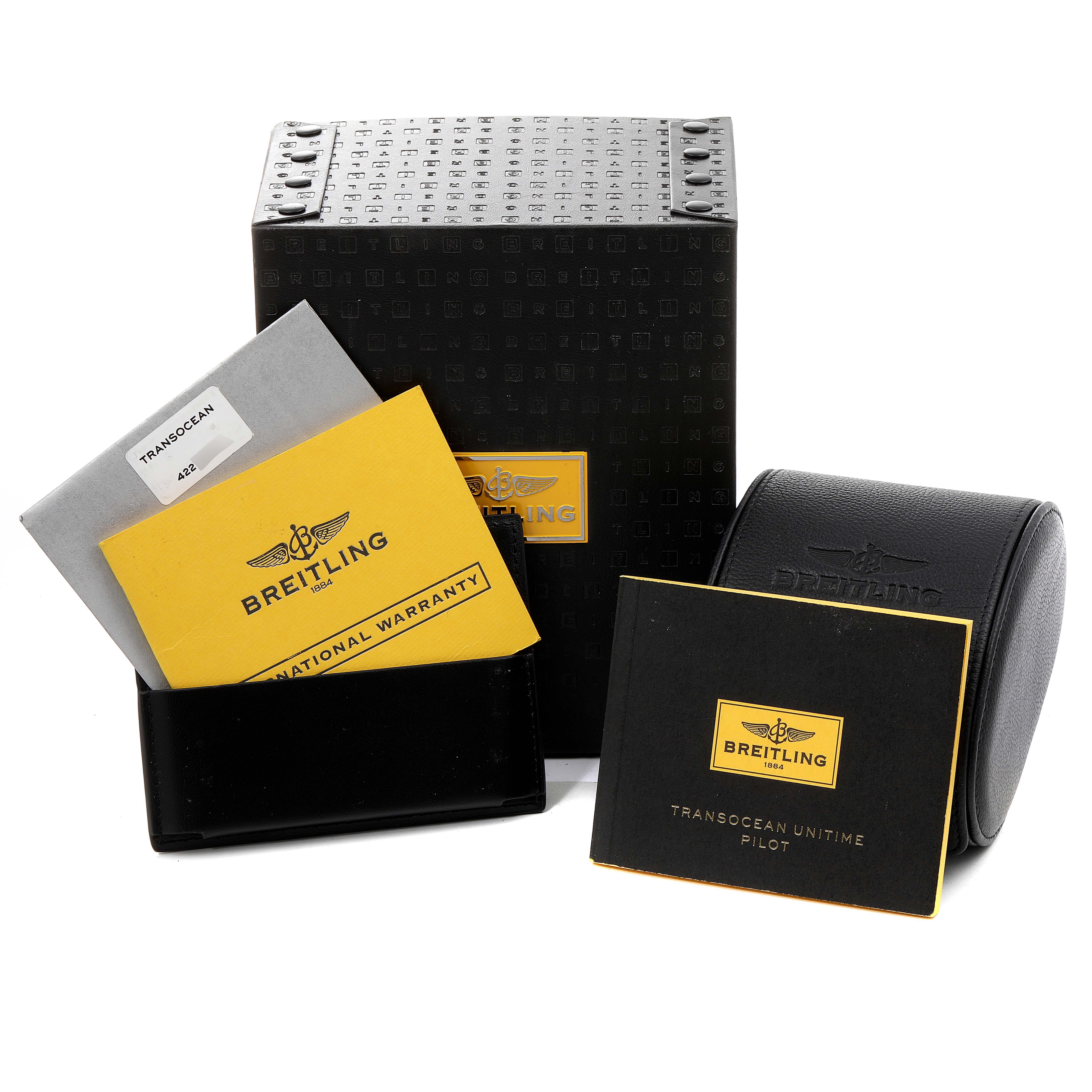 The image shows the packaging and accessories for a Breitling Transocean AB0510  Men's Stainless Steel Blue Dial AB0510  Men's Stainless Steel Blue Dial watch, including a box, warranty booklet, and manuals.