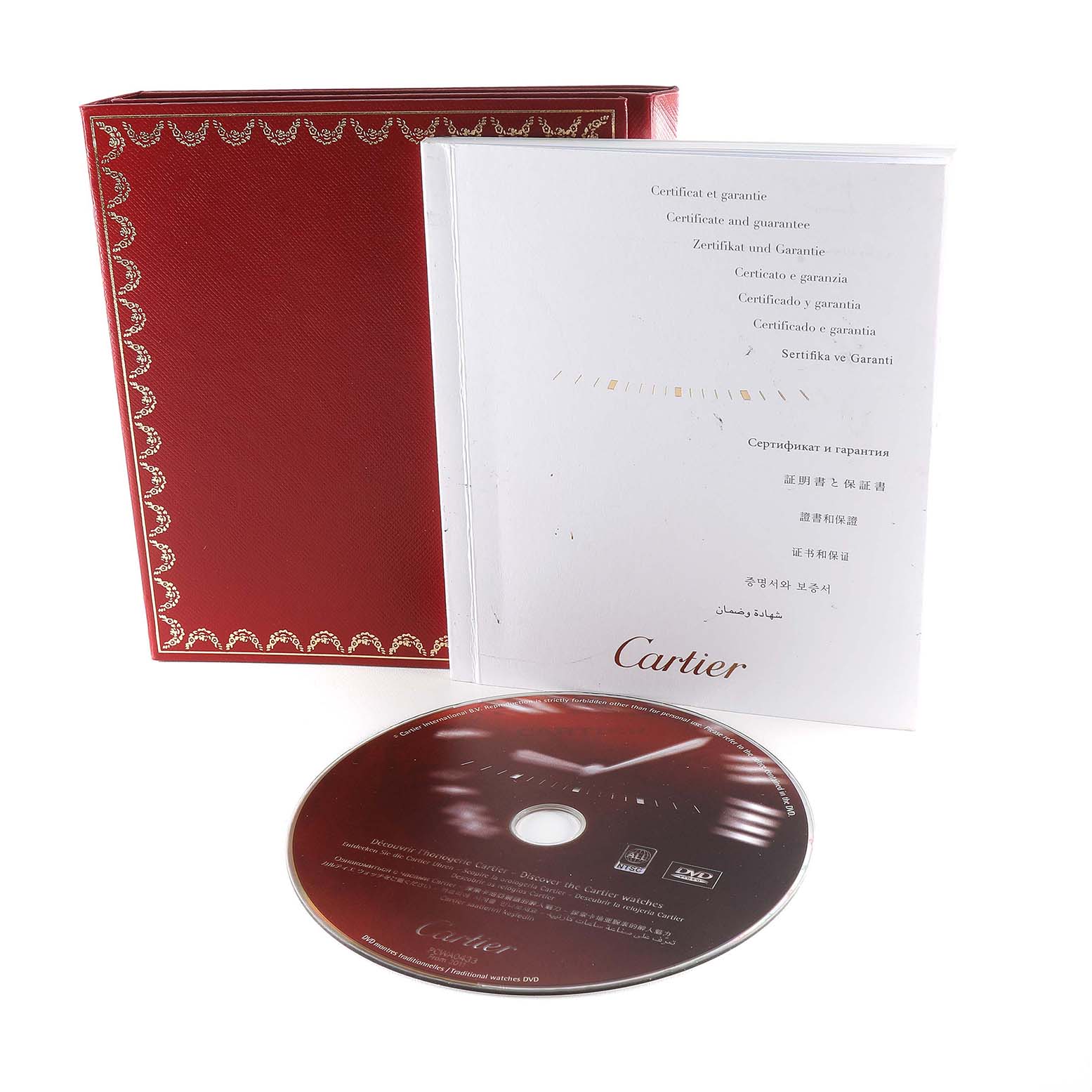 The image shows the accessories for the Cartier Ballon Bleu W6920033 Women's Steel and Gold (two tone) Mother of Pearl Dial W6920033 Women's Steel and Gold (two tone) Mother of Pearl Dial model, including a red box, instruction manual, and a DVD.