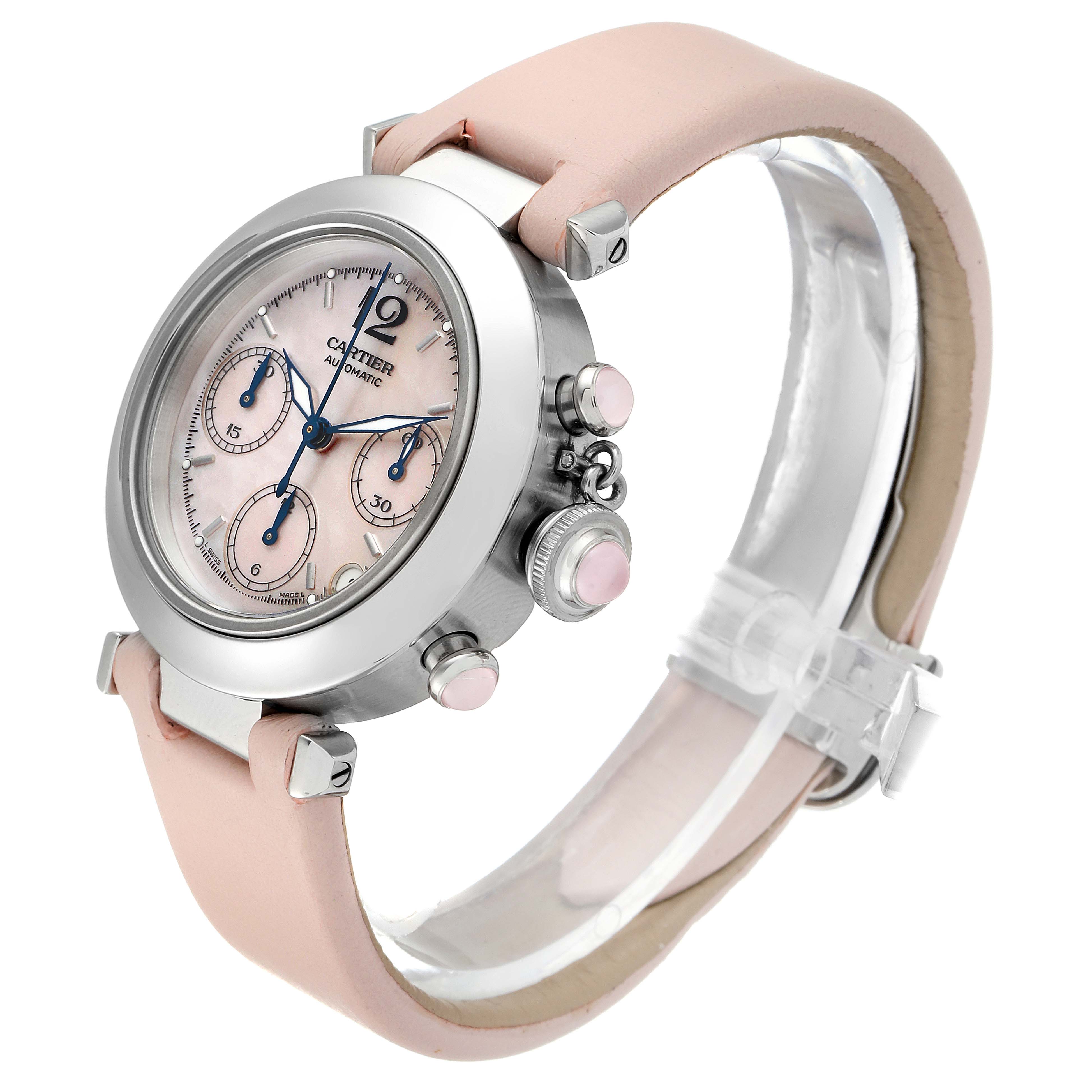 The image shows a side angle of a Cartier Pasha W3106599 Women's Stainless Steel Mother of Pearl Dial W3106599 Women's Stainless Steel Mother of Pearl Dial watch, highlighting its face, bezel, crown, and light pink leather strap.