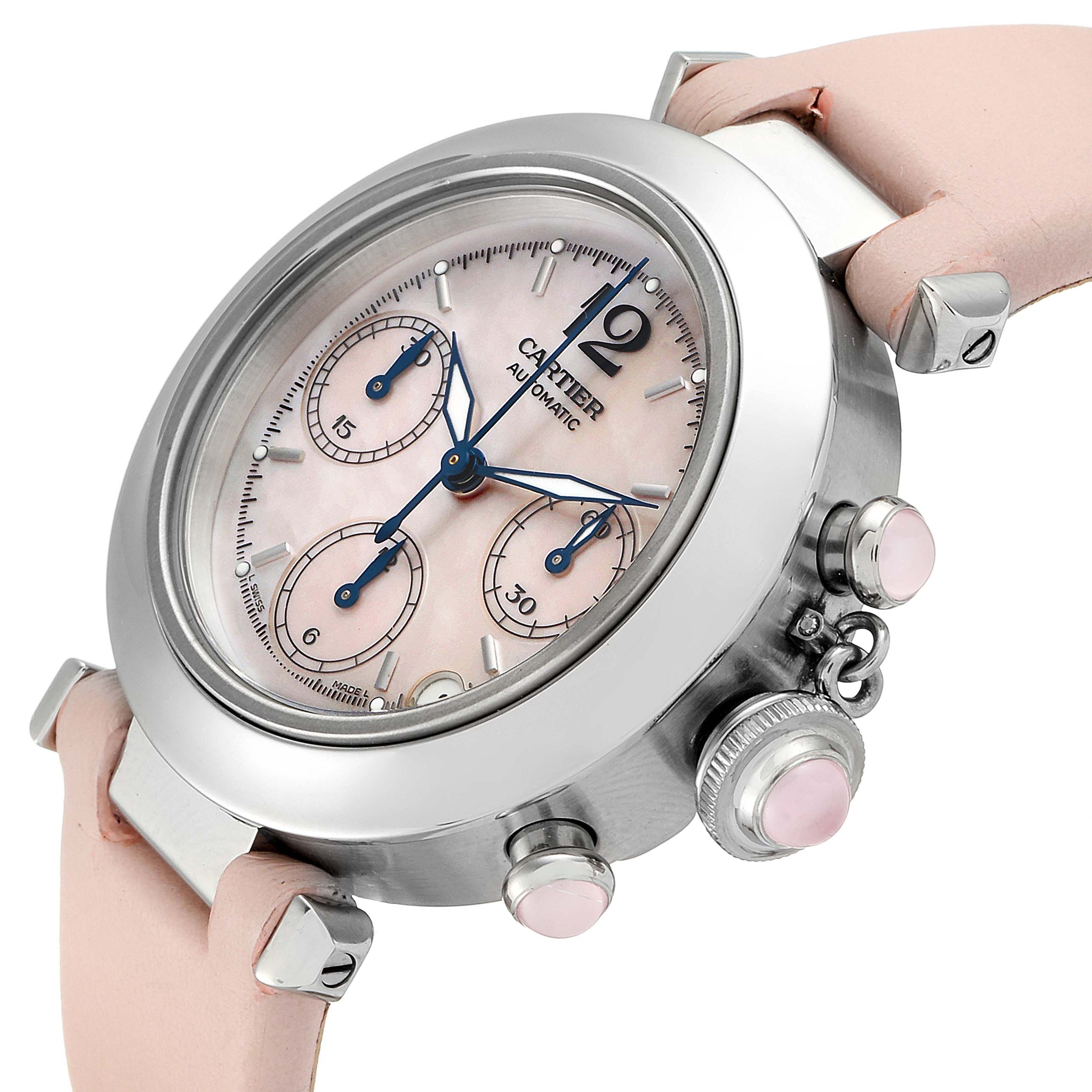 The image shows a Cartier Pasha W3106599 Women's Stainless Steel Mother of Pearl Dial W3106599 Women's Stainless Steel Mother of Pearl Dial watch angled to display its face, crown, pushers, and part of the pink leather strap.
