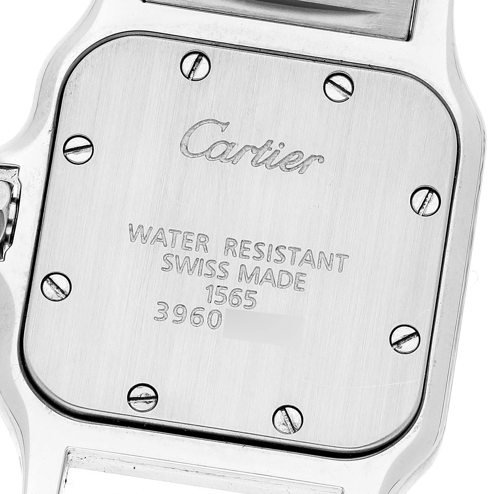 This image shows the case back of a Cartier Santos W20056D6 Women's Stainless Steel Silver Dial W20056D6 Women's Stainless Steel Silver Dial watch, highlighting its screws and engravings.