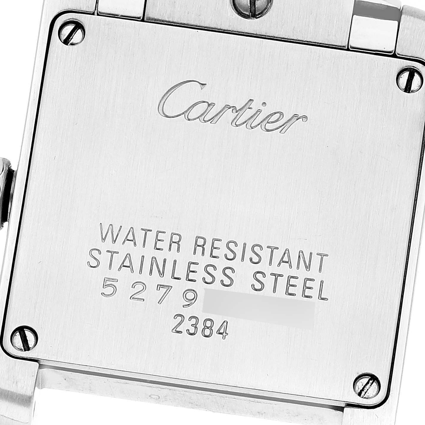 This image shows the case back of a Cartier Tank Française model, featuring the brand name, water resistance, stainless steel material, and serial numbers.