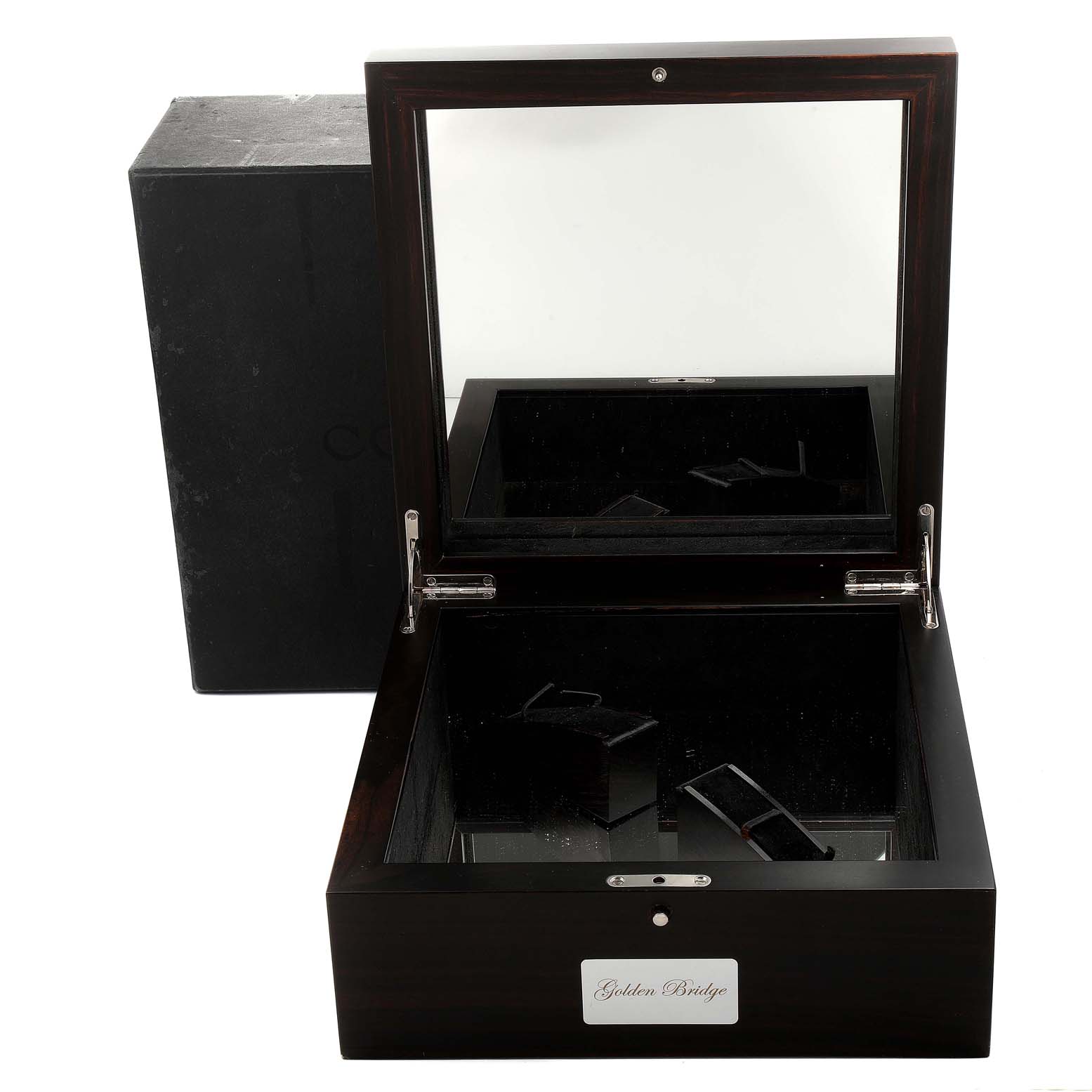 The image shows an open watch box for the Corum Golden Bridge B113/01043 - 113.160.55/0002 0000 Men's Rose Gold Transparent Dial B113/01043 - 113.160.55/0002 0000 Men's Rose Gold Transparent Dial model, highlighting the interior and exterior.