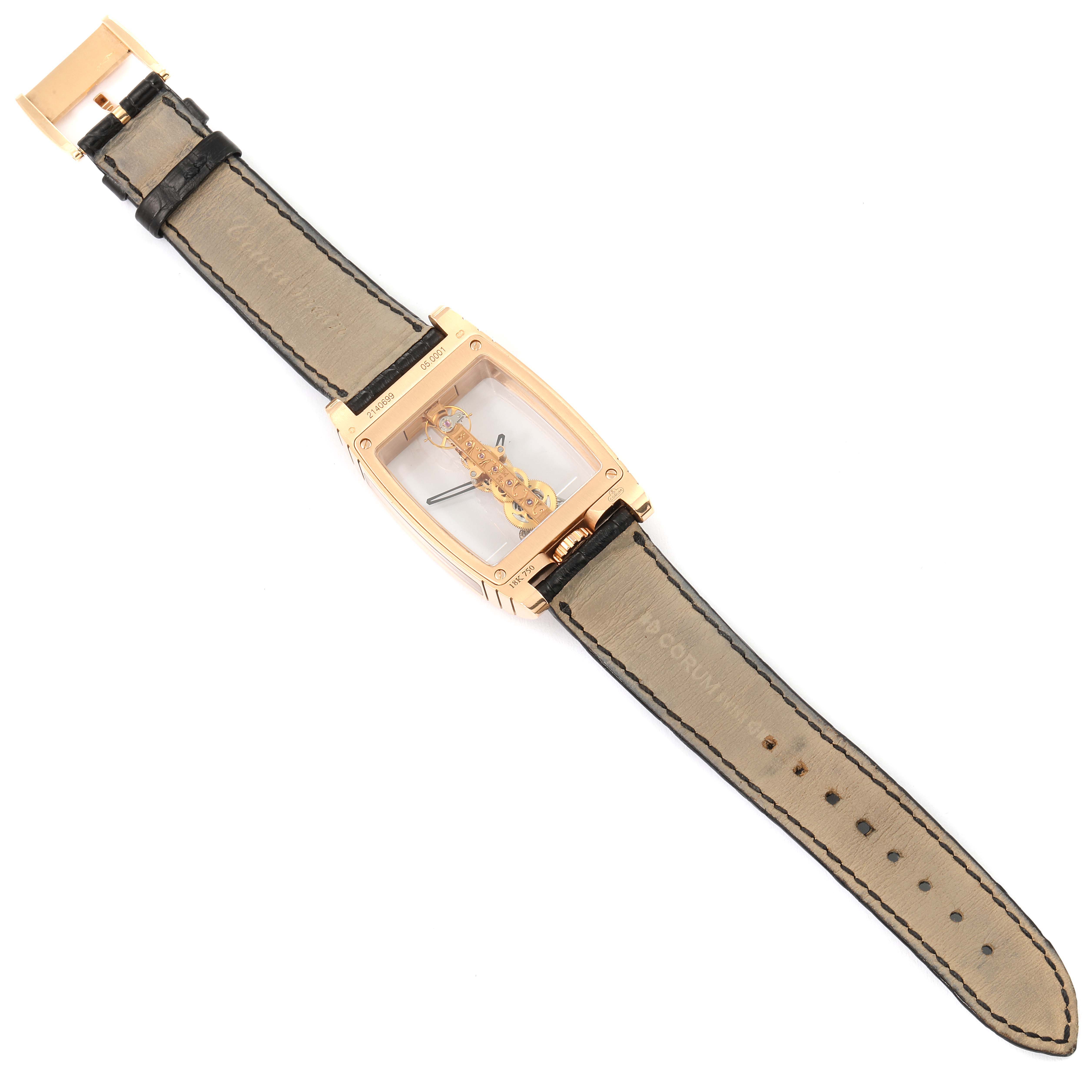 The image shows an overhead view of the Corum Golden Bridge B113/01043 - 113.160.55/0002 0000 Men's Rose Gold Transparent Dial B113/01043 - 113.160.55/0002 0000 Men's Rose Gold Transparent Dial watch, highlighting its rectangular case and leather strap.