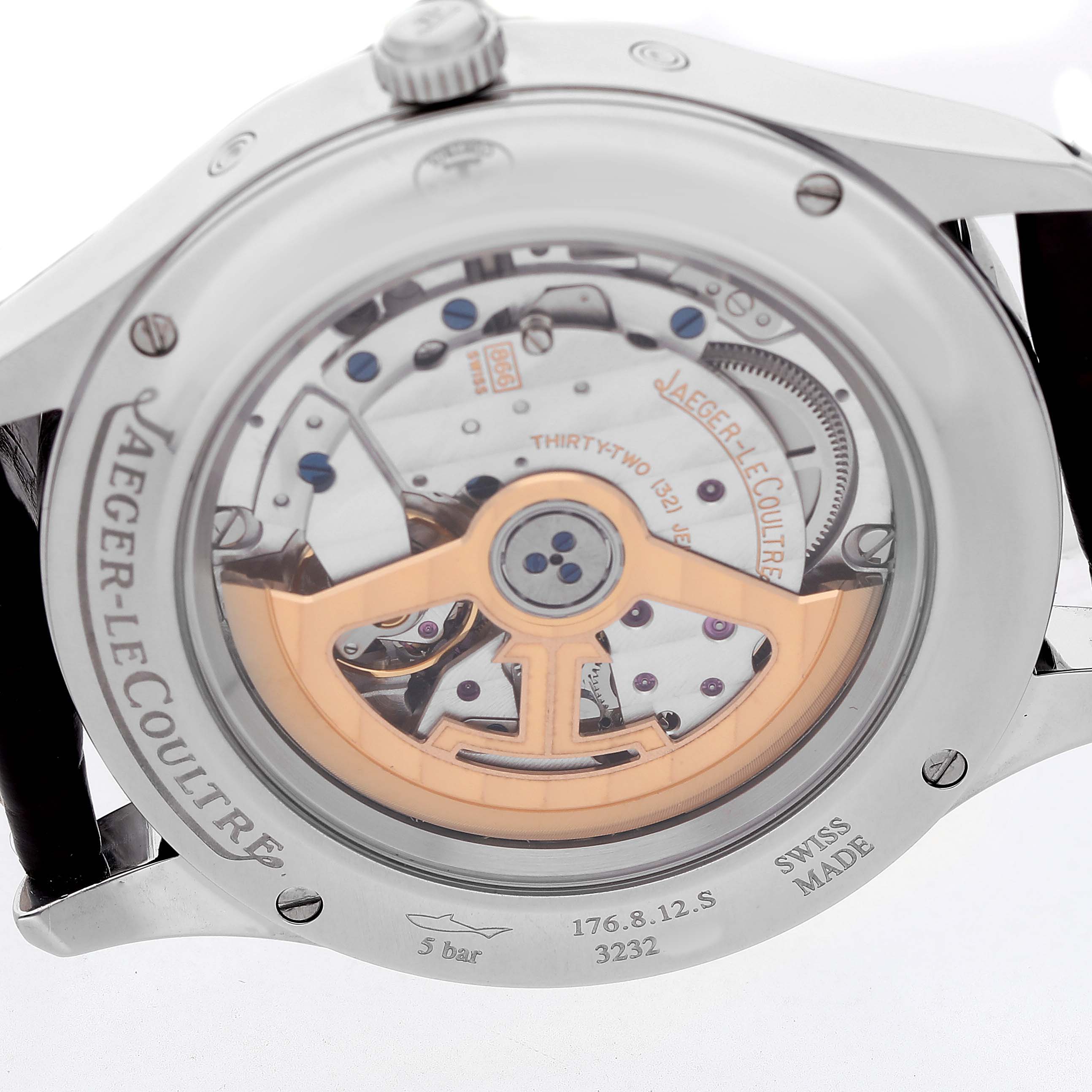 The image shows the backside of a Jaeger-LeCoultre Master watch, displaying its intricate automatic movement and rotor.