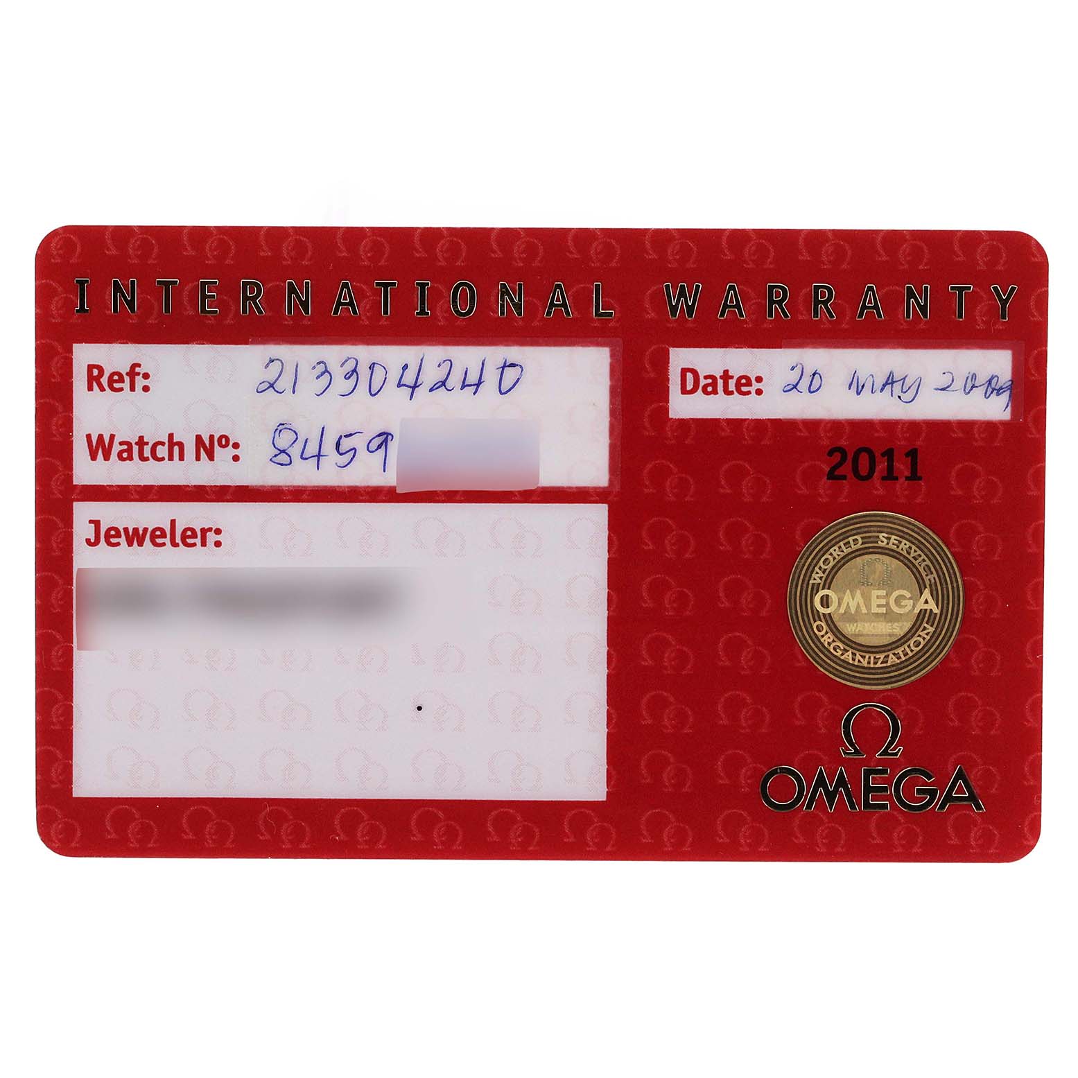 The image shows an Omega international warranty card for a Seamaster model, including reference number and purchase date.