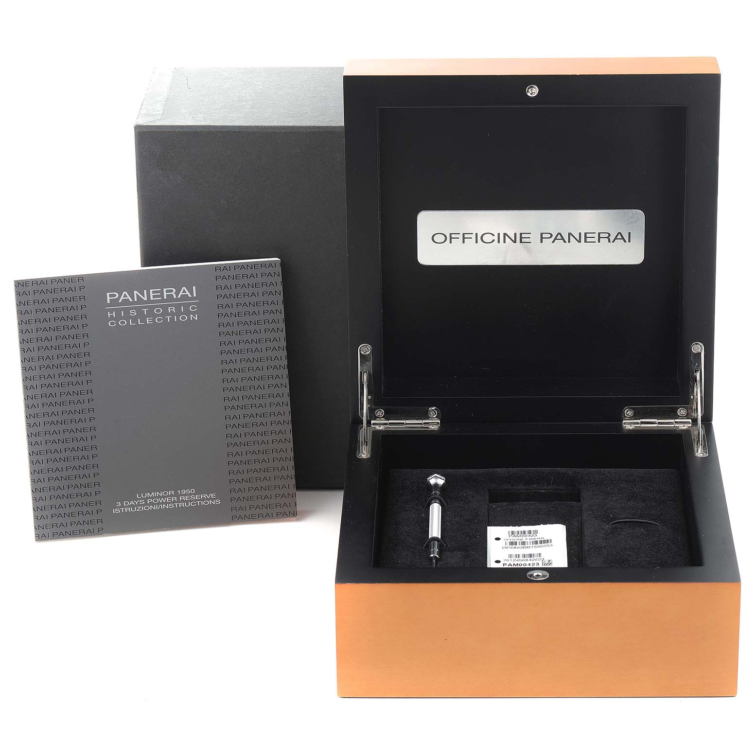 The image shows an open Panerai Luminor PAM00423 Men
s Stainless Steel Black Dial PAM00423 Men
s Stainless Steel Black Dial watch box, an instruction booklet, and a tool in the box.