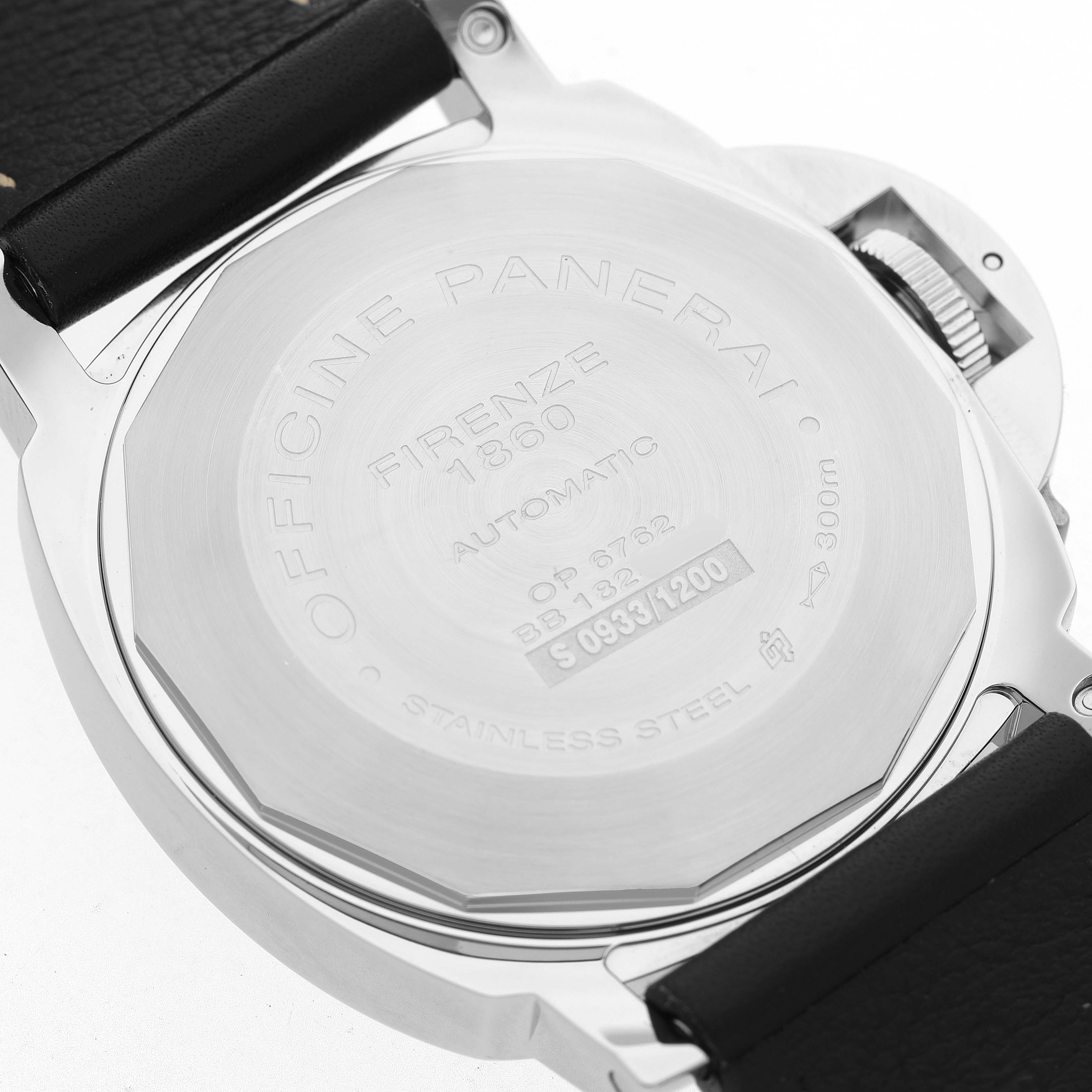 The image shows the back case and strap of a Panerai Luminor PAM00090 Men's Stainless Steel Black Dial watch, emphasizing its engravings and stainless steel design.