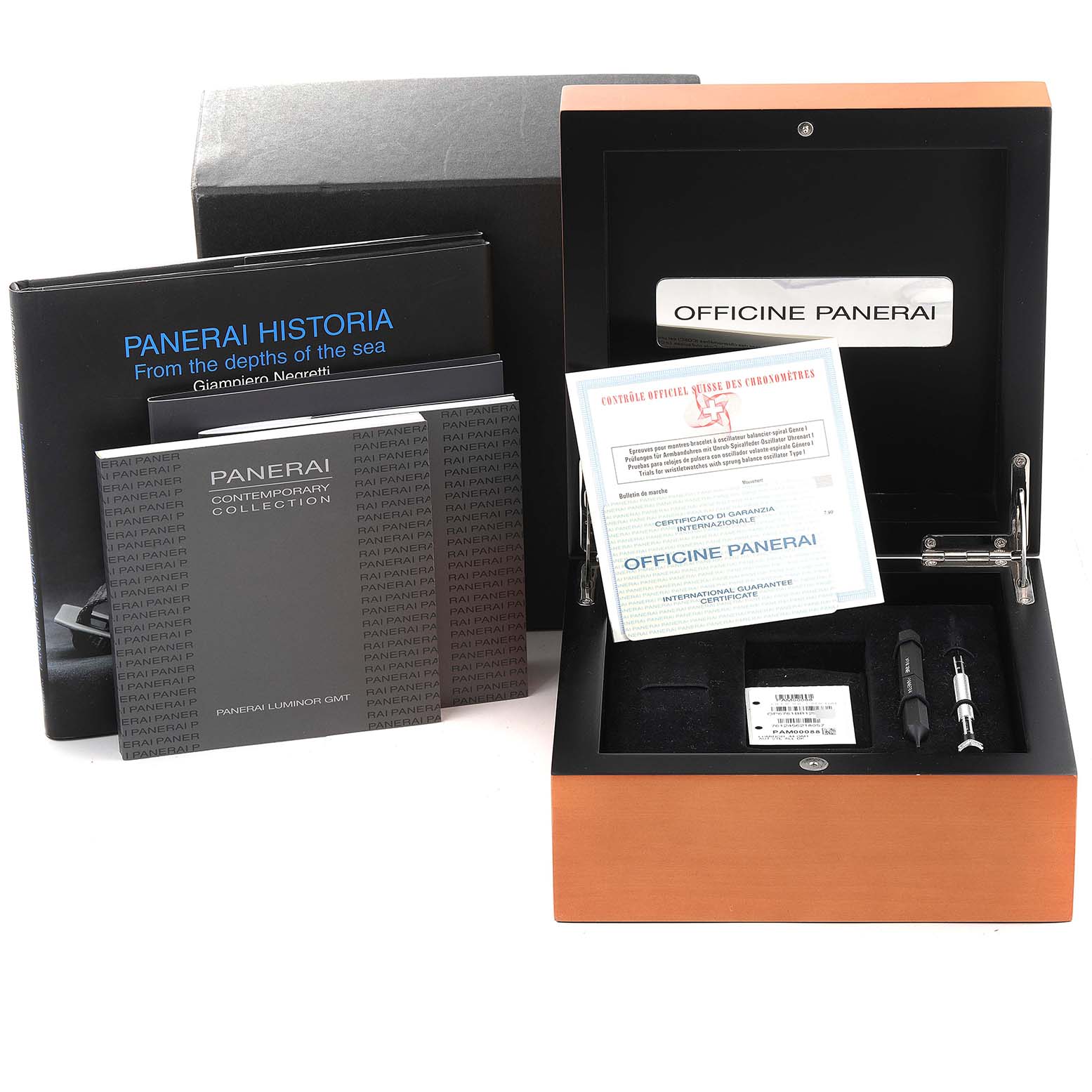 The image shows the open packaging, manuals, and accessories of a Panerai Luminor PAM00088 Men
s Stainless Steel Black Dial PAM00088 Men
s Stainless Steel Black Dial watch.