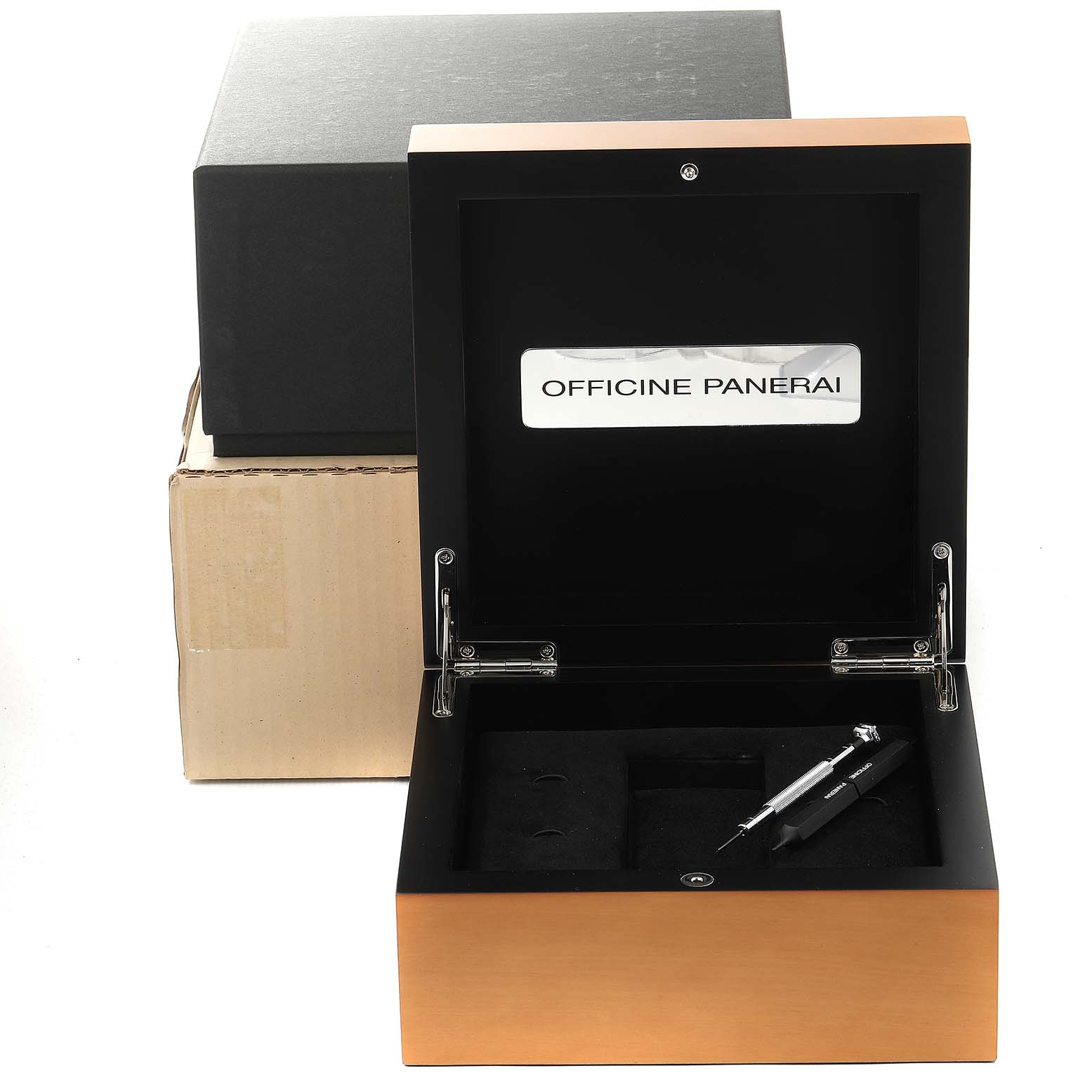 This image shows an open Panerai Radiomir PAM00421 Men's Rose Gold Brown Dial PAM00421 Men's Rose Gold Brown Dial watch box containing a tool, with packaging visible in the background.