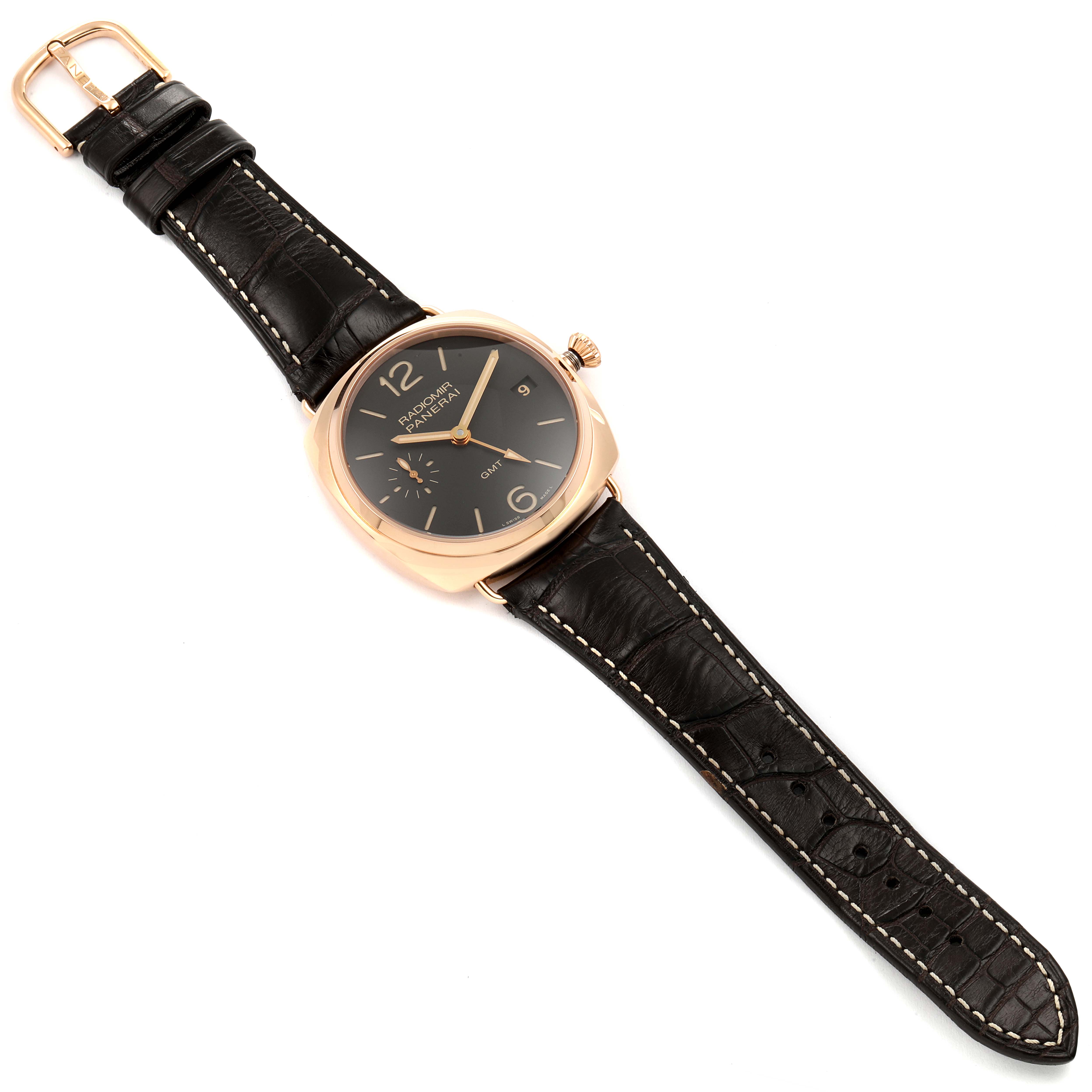 The Radiomir model by Panerai is shown at a top-down angle, displaying its black leather strap and round dial.