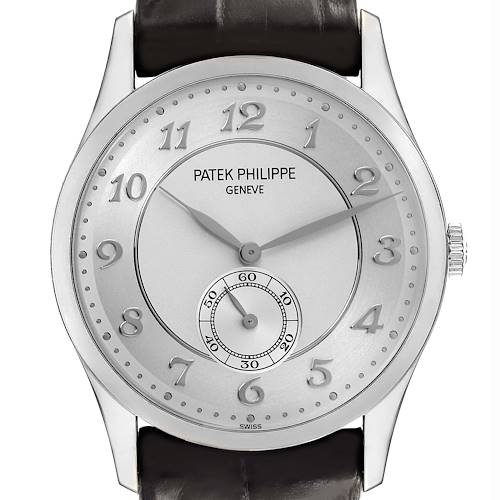 The Patek Philippe Calatrava watch is shown from the front, highlighting its dial, Roman numerals, and subdial.