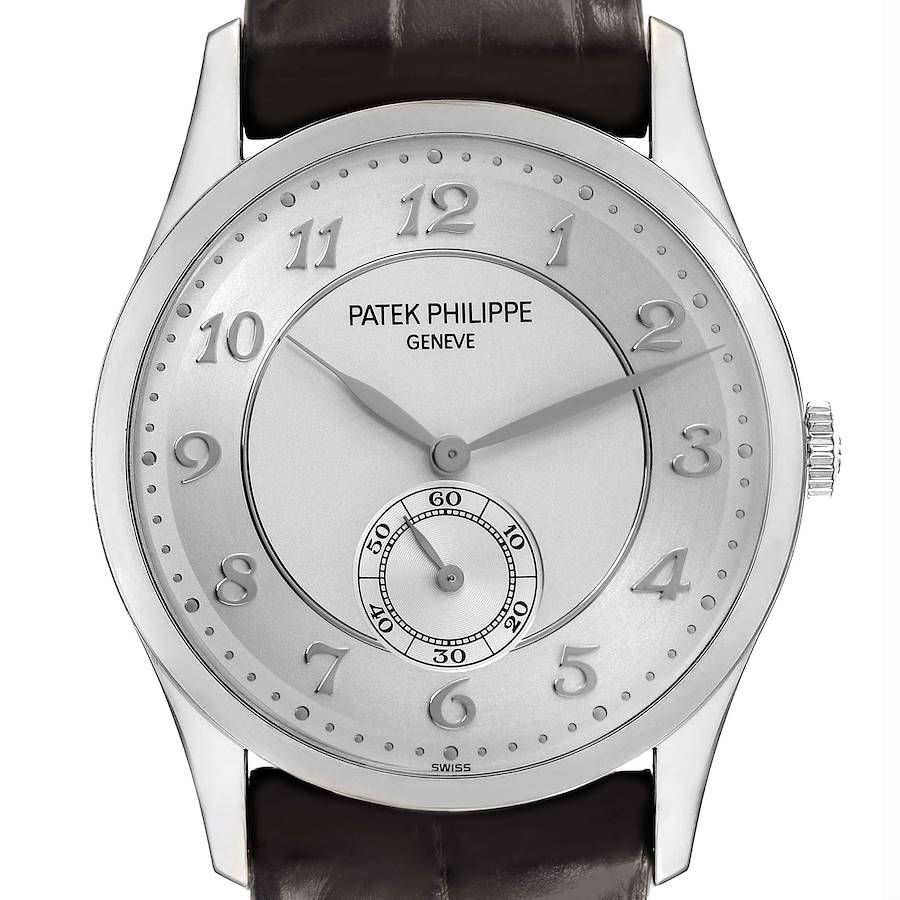 The Patek Philippe Calatrava watch is shown from a front angle, displaying the dial with a subdial, hour markers, and the crown.