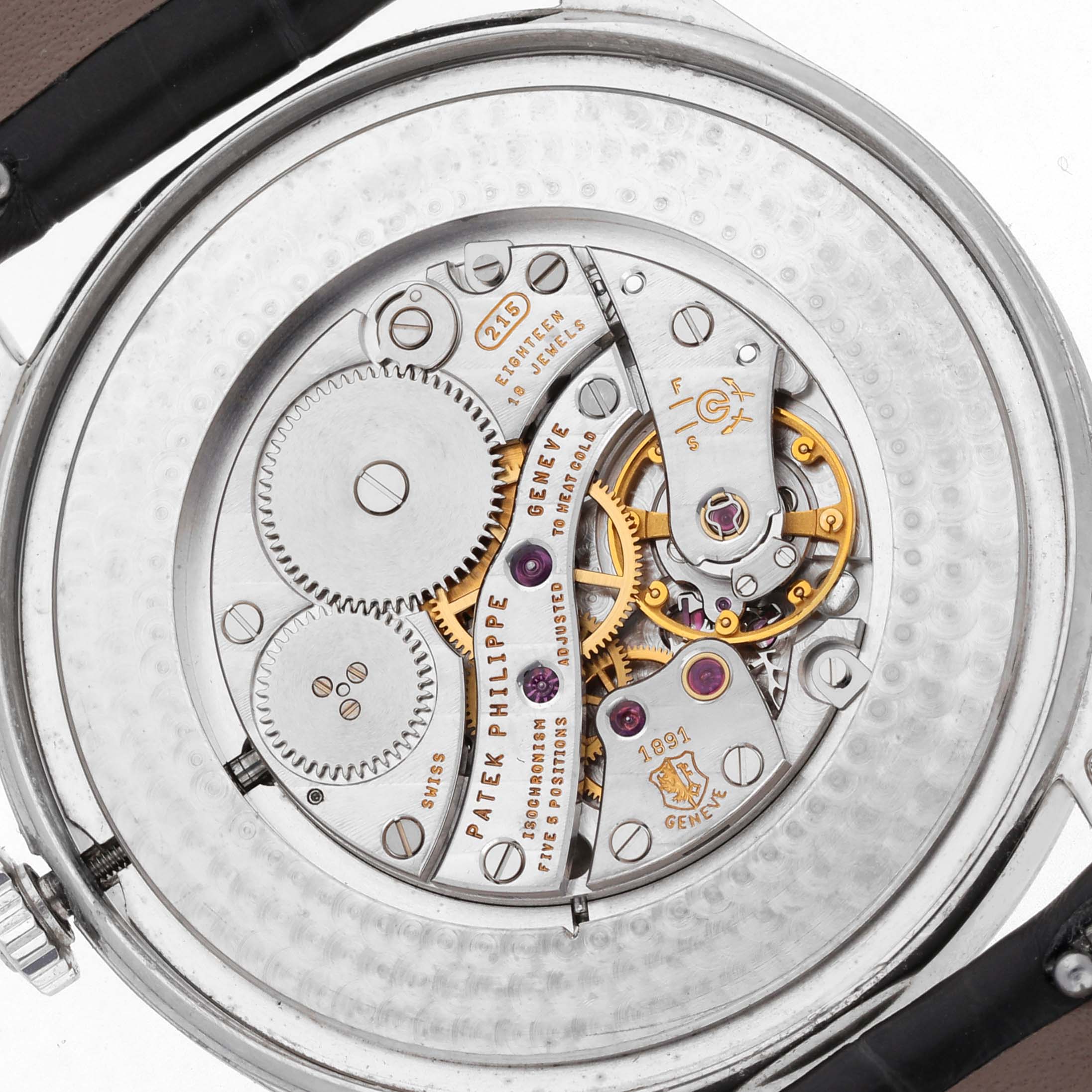 The image shows the back view of a Patek Philippe Calatrava 5196P-001 Men's Platinum Silver Dial 5196P-001 Men's Platinum Silver Dial watch, highlighting its intricate mechanical movement.