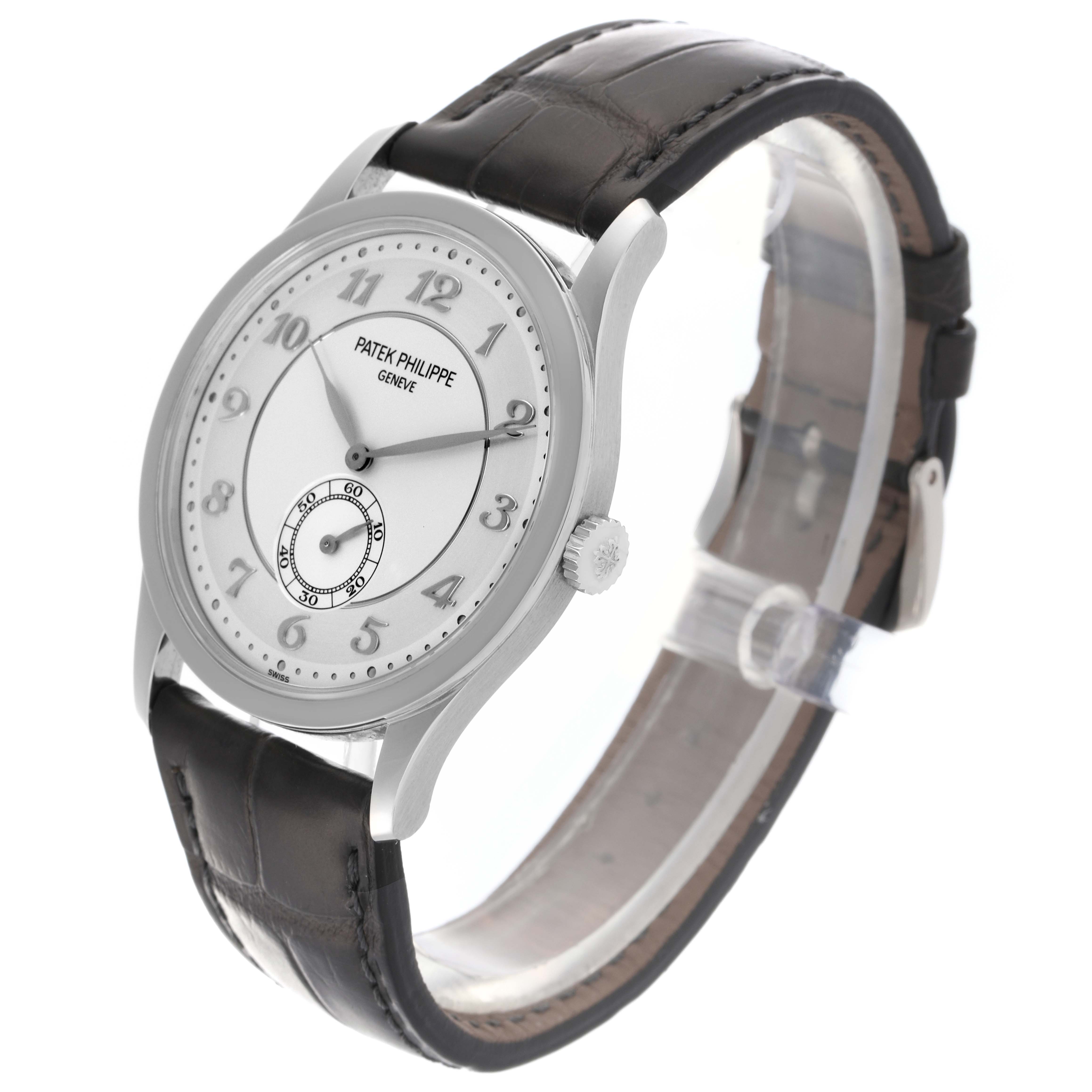 The Patek Philippe Calatrava 5196P-001 Men's Platinum Silver Dial 5196P-001 Men's Platinum Silver Dial watch is shown at a three-quarter angle, displaying the dial, case, crown, and strap.